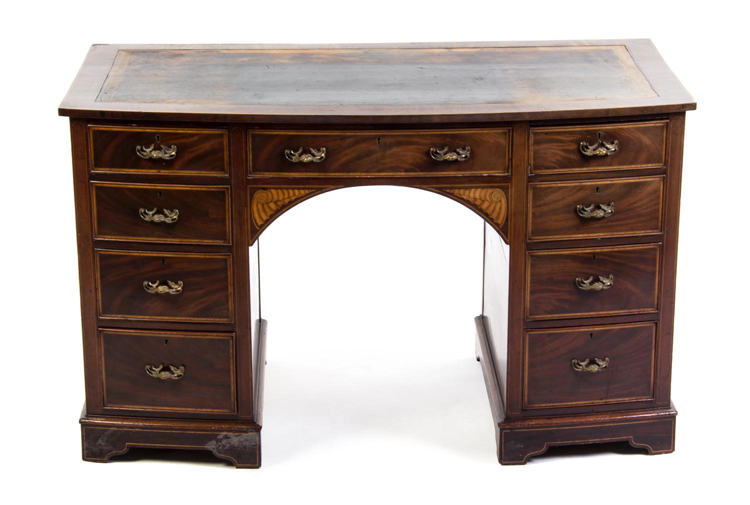 An English Marquetry and Mahogany Bow Front Desk, Height 28 1/2 x width 48 x depth 25 1/2 inches.