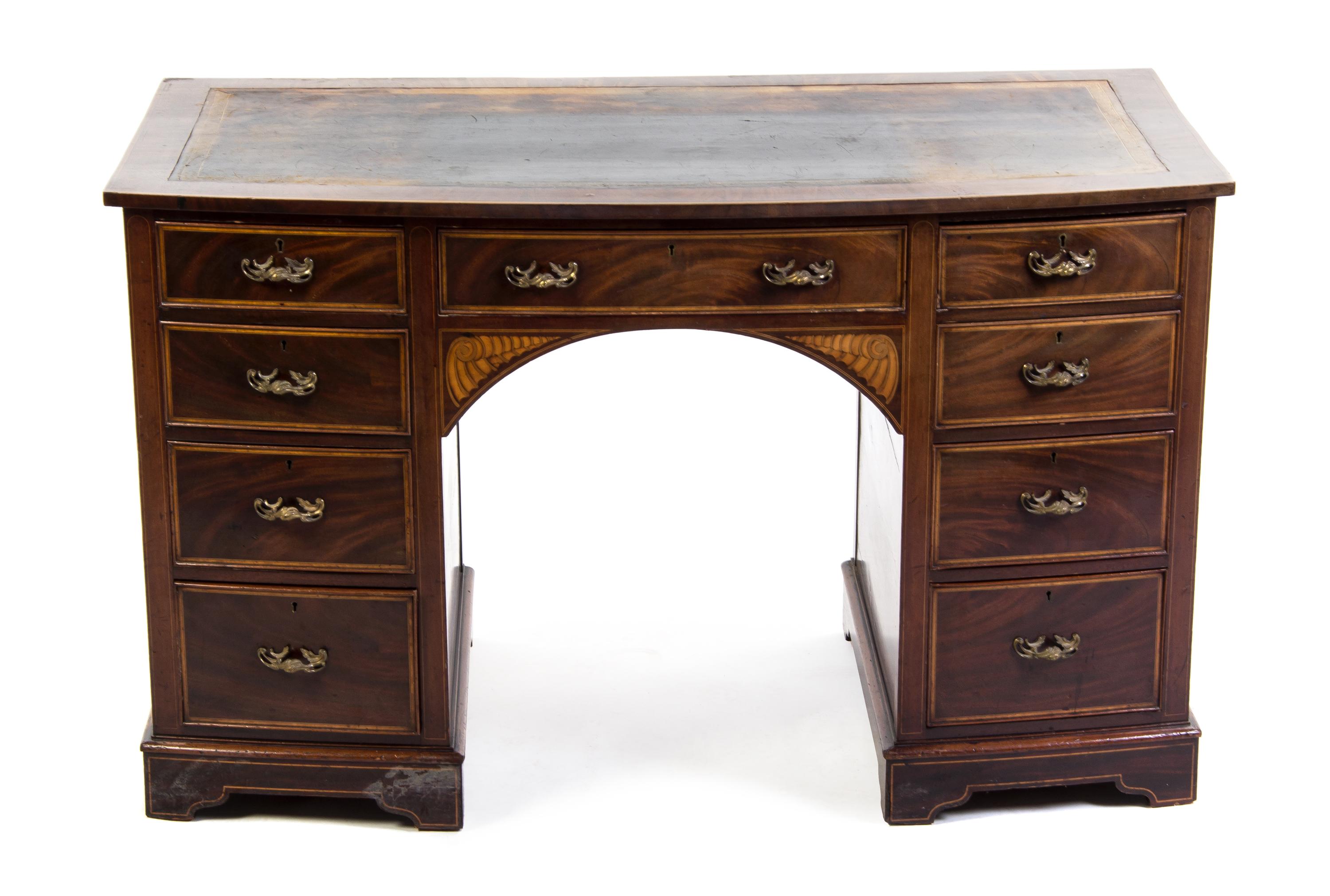 An English Marquetry and Mahogany Bow Front Desk, Height 28 1/2 x width 48 x depth 25 1/2 inches.