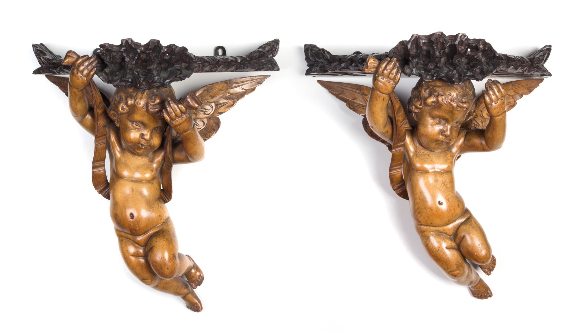 A Pair of Continental Carved Figural Wall Brackets Height 13 1/4 inches.