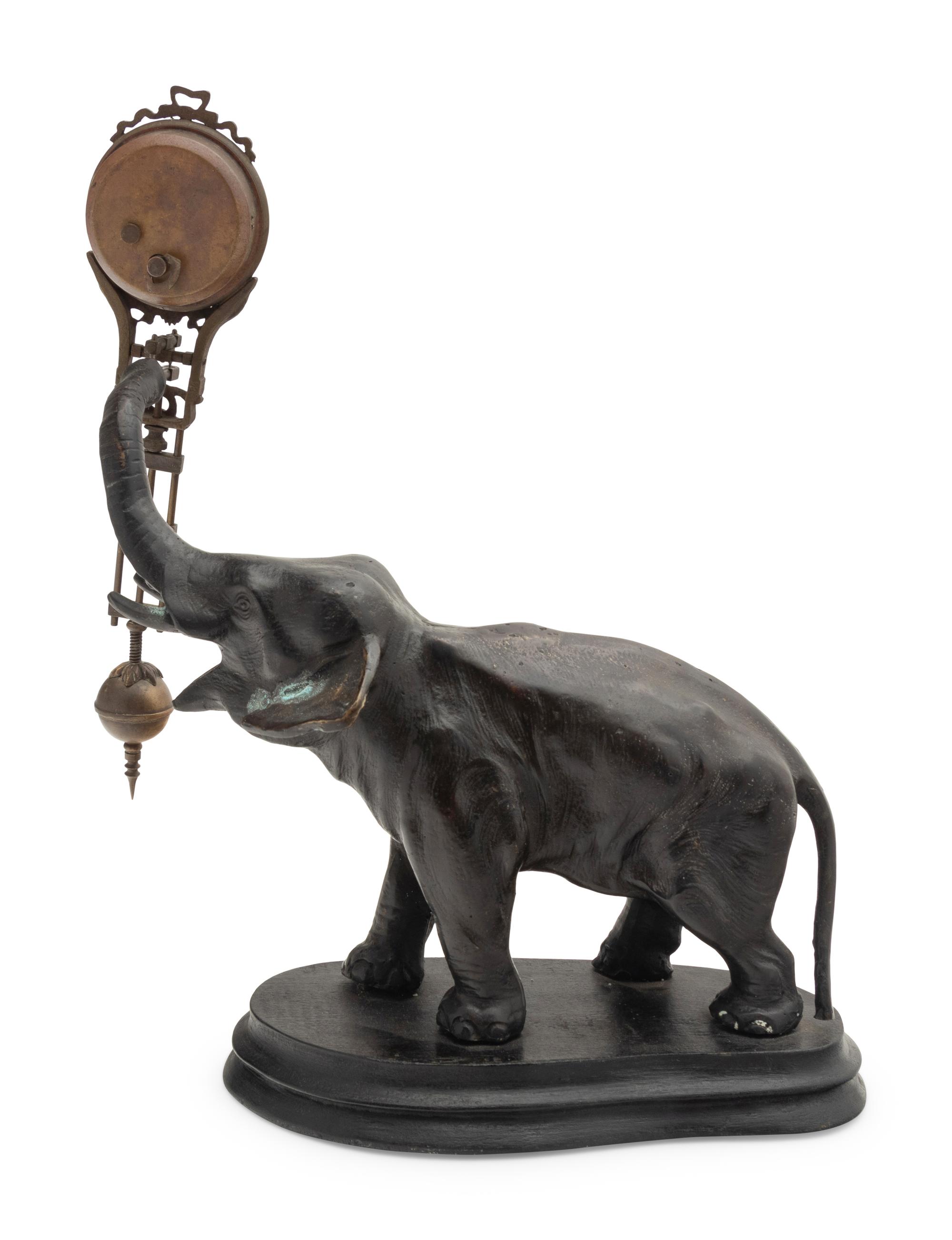 A Continental Cast Metal Elephant-Form Swinging Clock
