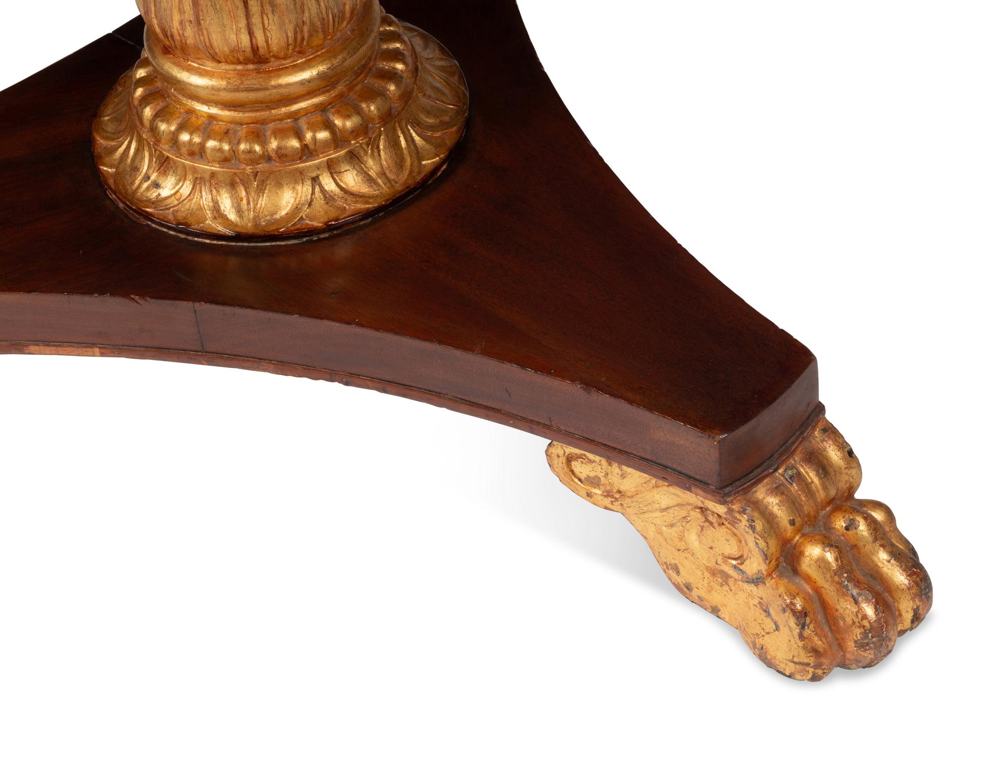 A Victorian Mahogany and Parcel Gilt "Rent" Table