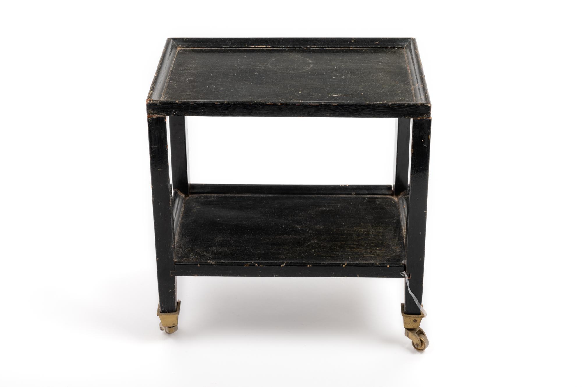 A Black Painted "Telephone Table" in the Style of Karl Springer