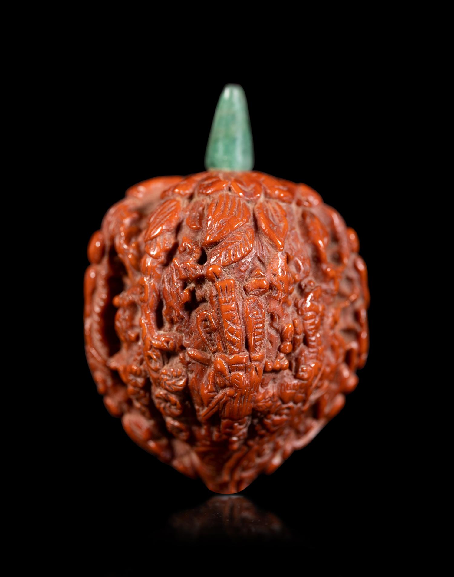 A Chinese Carved Peach Pit Snuff Bottle
