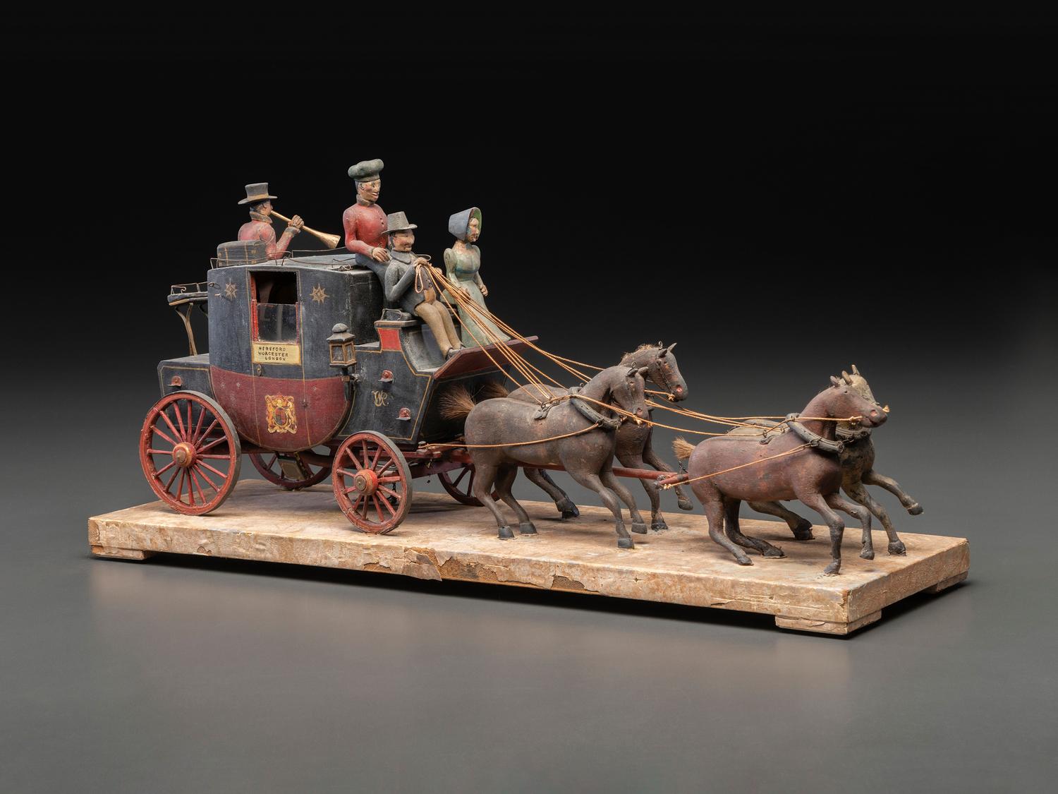 A Folk Art Carved and Painted Wood English Royal Stagecoach