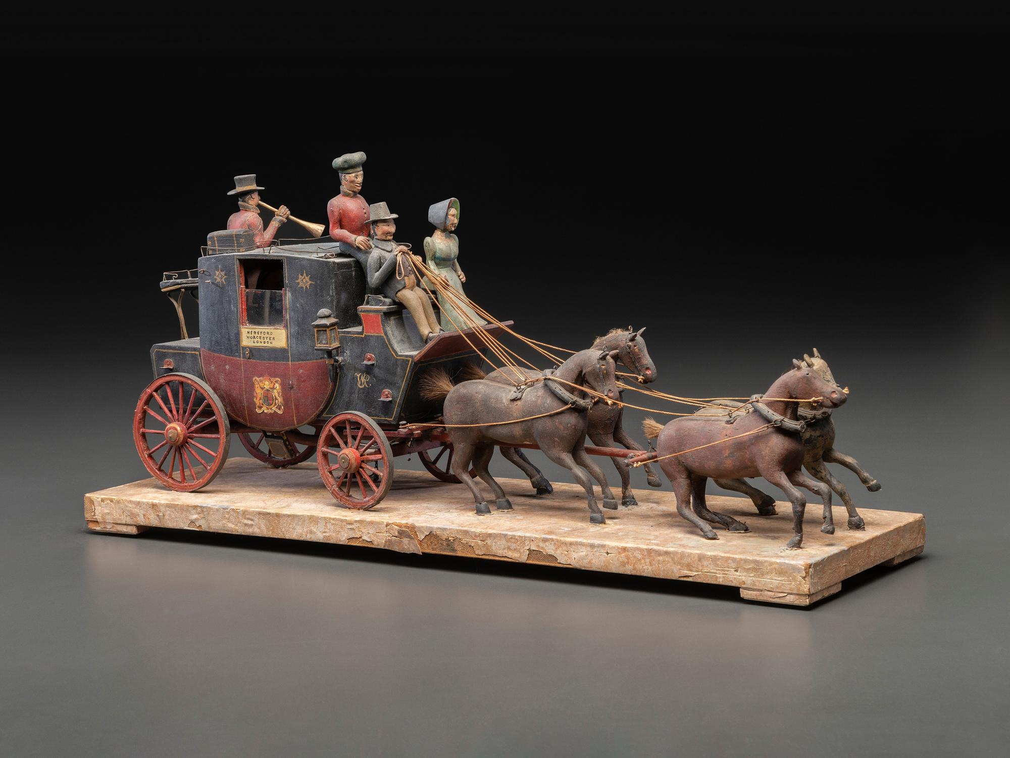A Folk Art Carved and Painted Wood English Royal Stagecoach