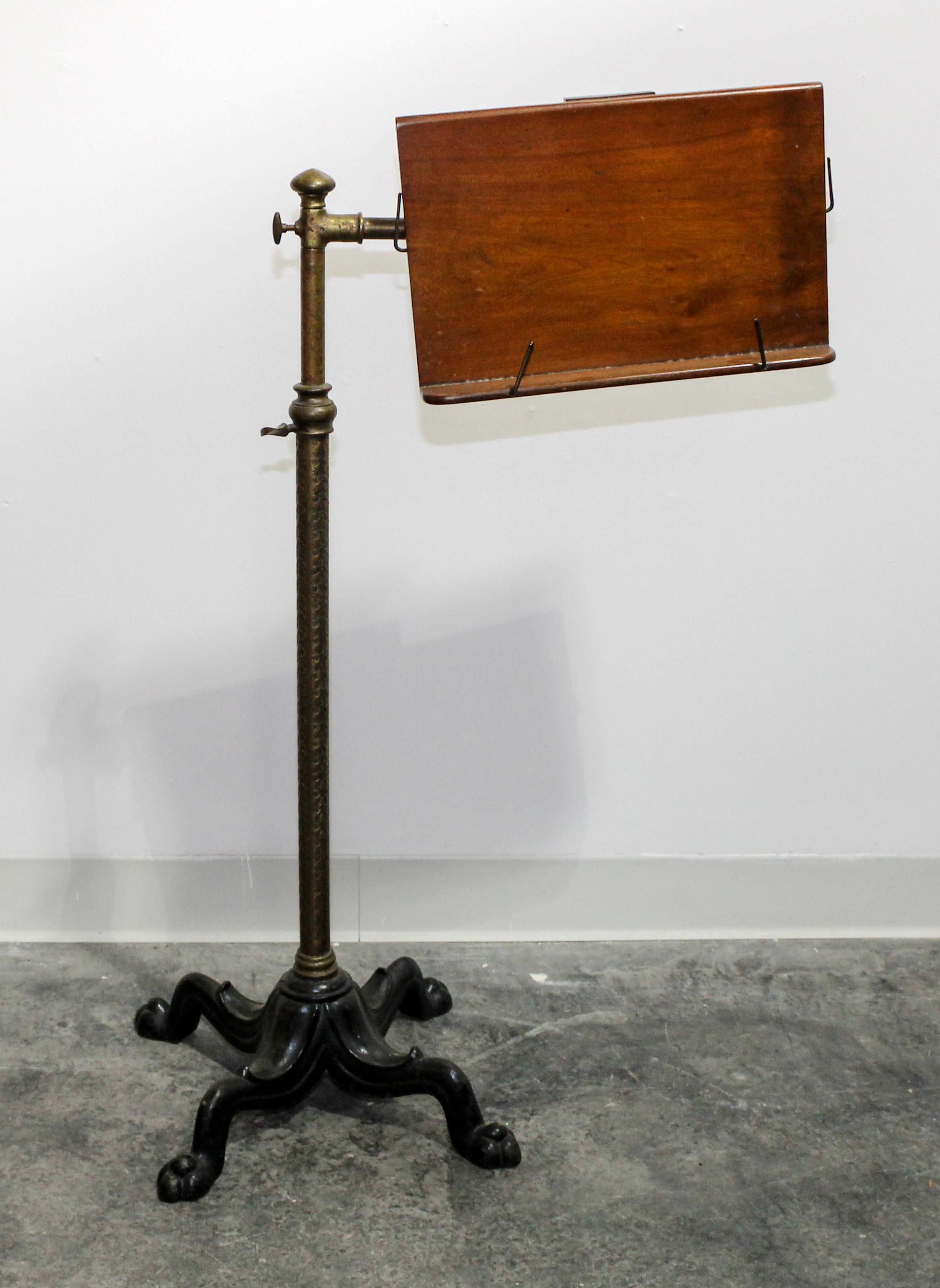 A Wood and Metal Book Stand Height 37 inches.