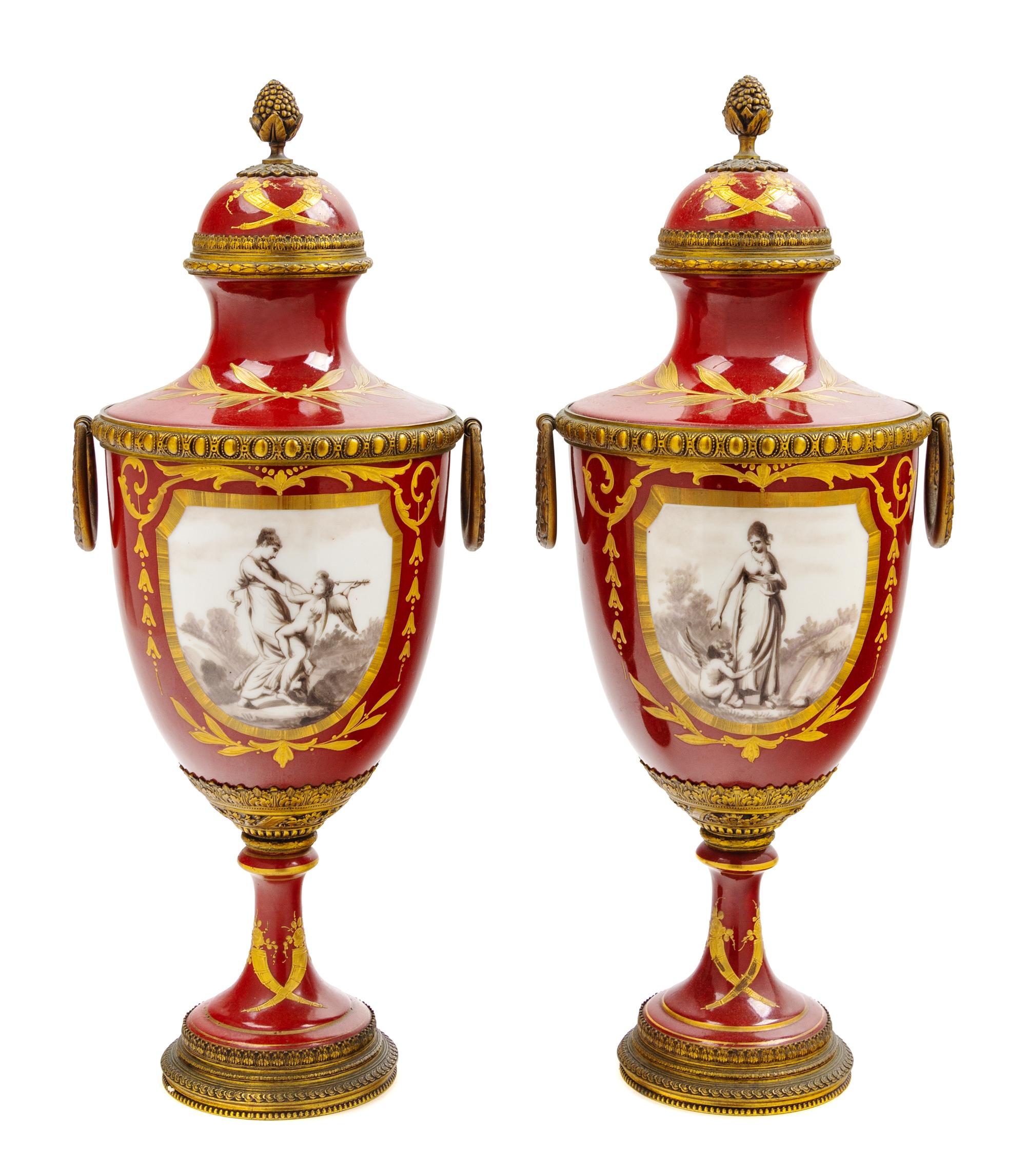 A Pair of French Gilt Metal Mounted Porcelain Urns Height 17 1/8 inches. — LATE 19TH CENTURY