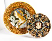 A Collection of Four Polychrome Majolica Chargers Diameter of largest 22 inches.