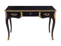 A Louis XV Style Gilt Metal Mounted Ebonized Bureau Plat