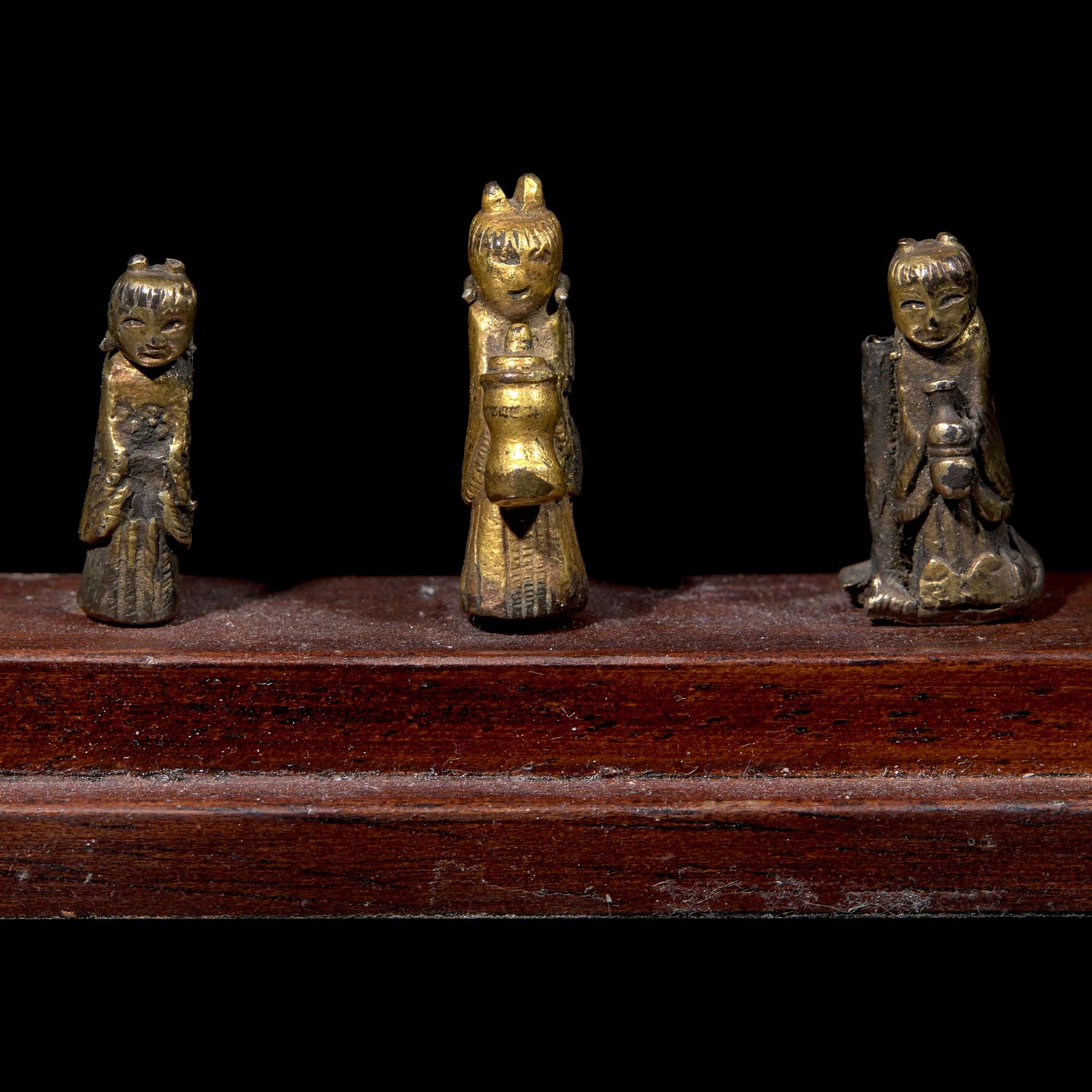 An Unusual Group of Three Chinese Gilt Bronze Miniature Deities, Ming Dynasty 明 銅鎏金袖珍小佛一組三件