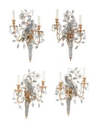 A Set of Four Gilt Metal and Glass Two-Light Sconces in the Style of Maison Baguès