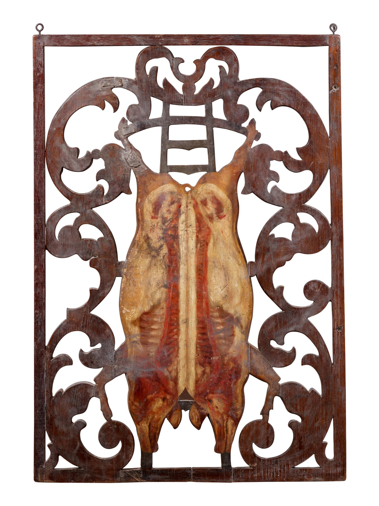 A Continental Carved and Polychrome Decorated Two Sided Butcher's Trade Sign
