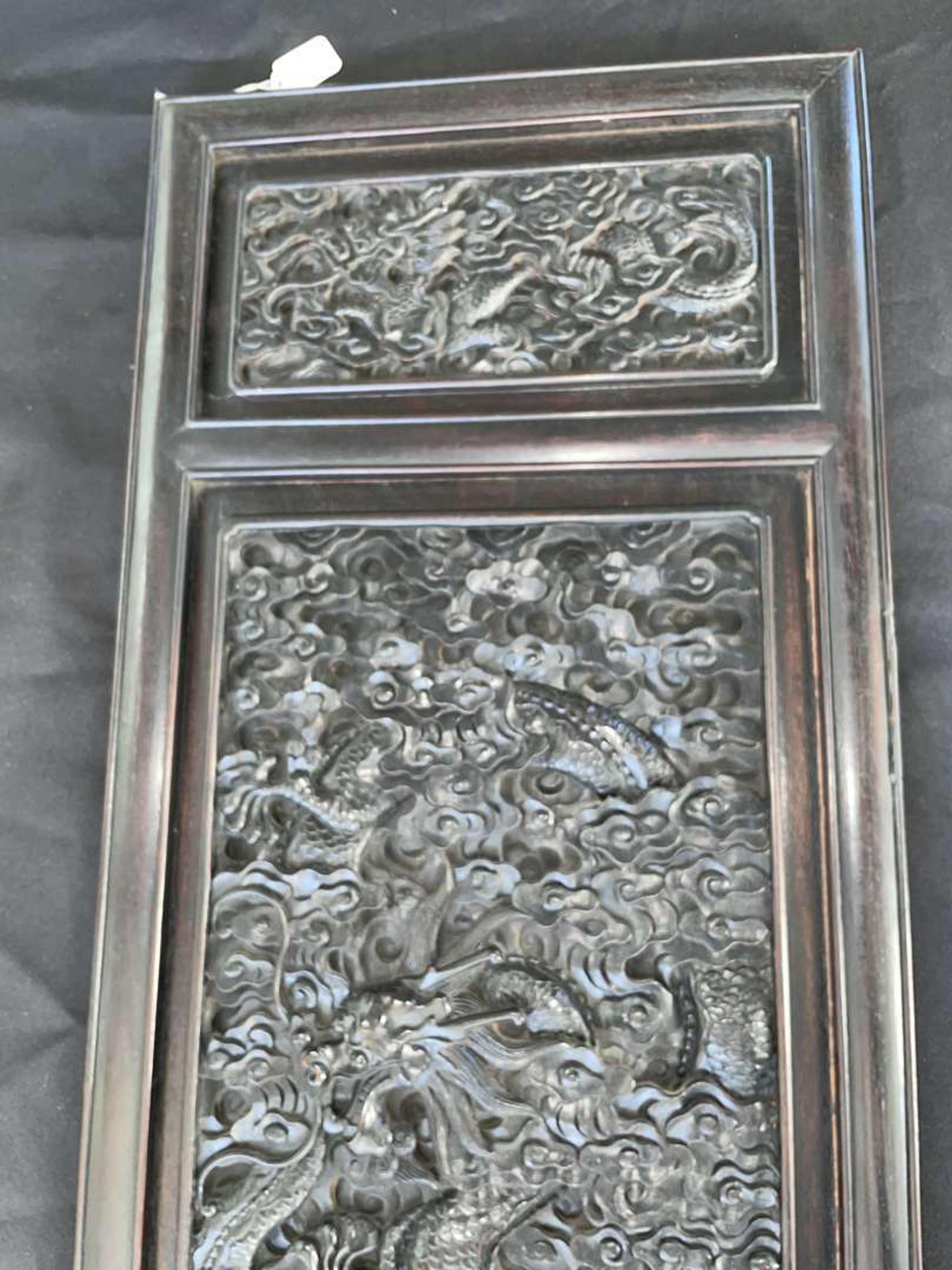 A Chinese carved hardwood six-panel “Dragons” screen 硬木浮雕龙纹六开屏风