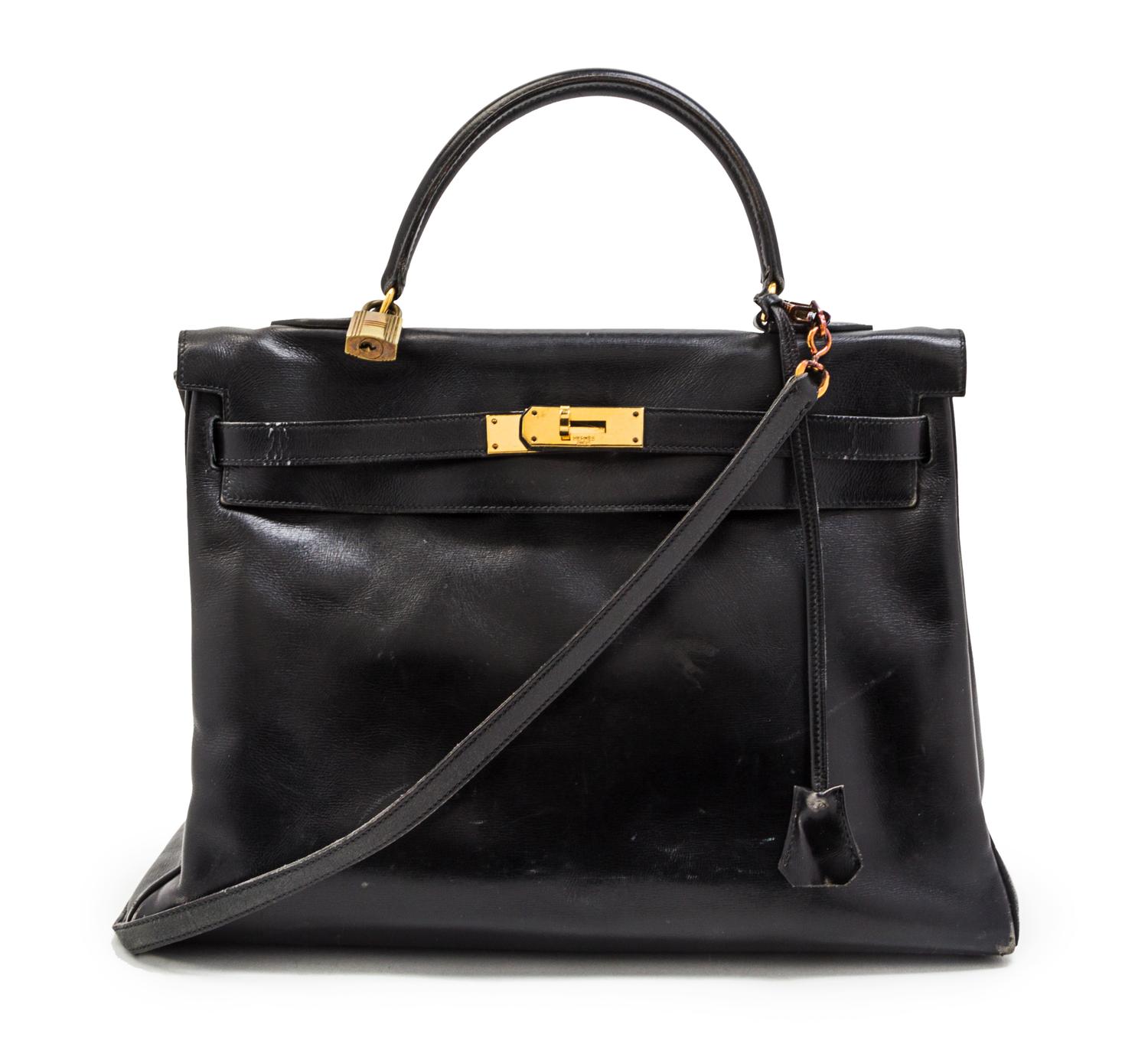 An Hermes 35cm Black Leather Kelly Bag, 14 x 8 x 7 inches.