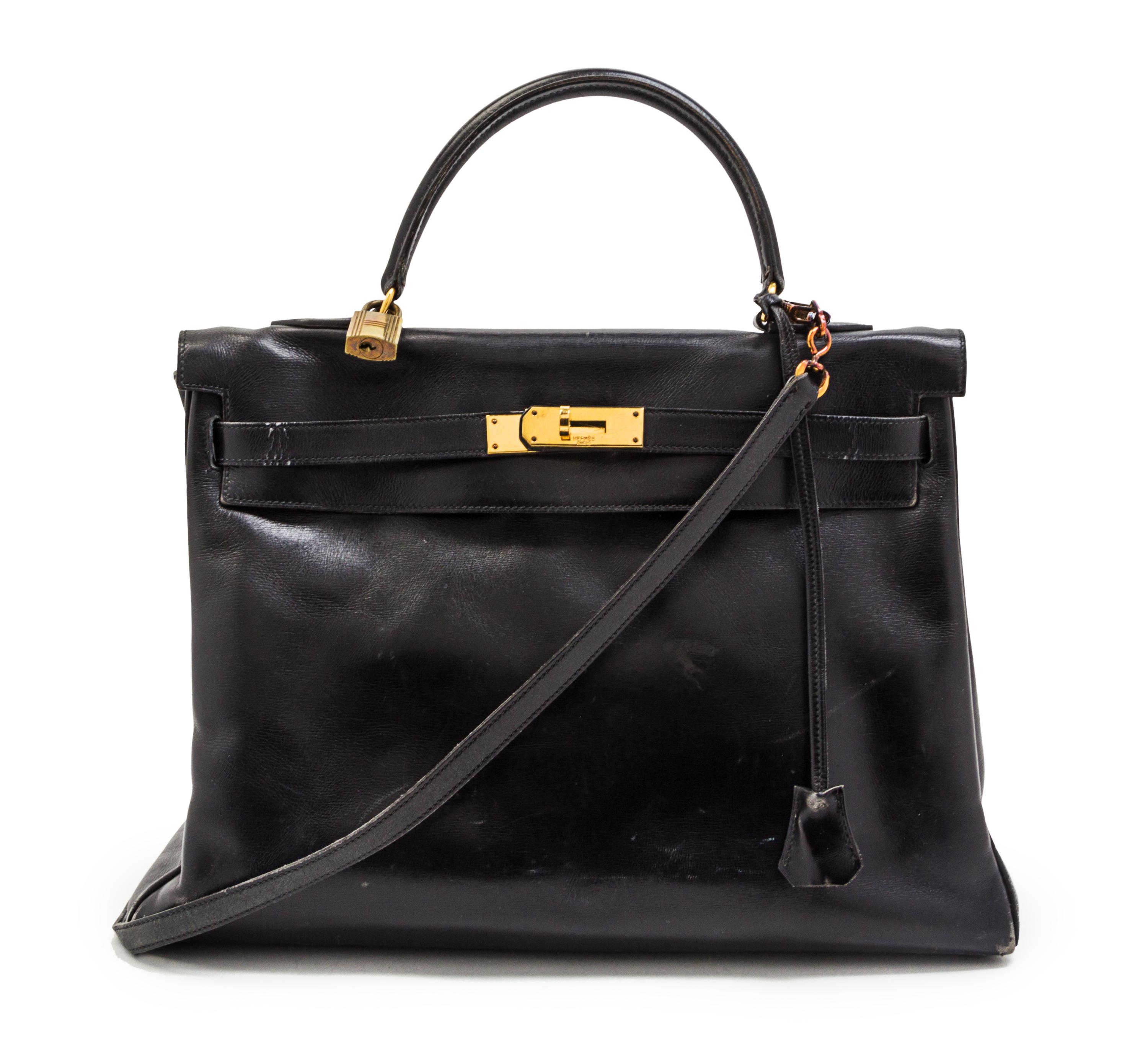 An Hermes 35cm Black Leather Kelly Bag, 14 x 8 x 7 inches.