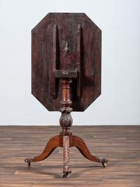 A Late Federal Carved and Figured Mahogany Octagonal Tilt-Top Candlestand