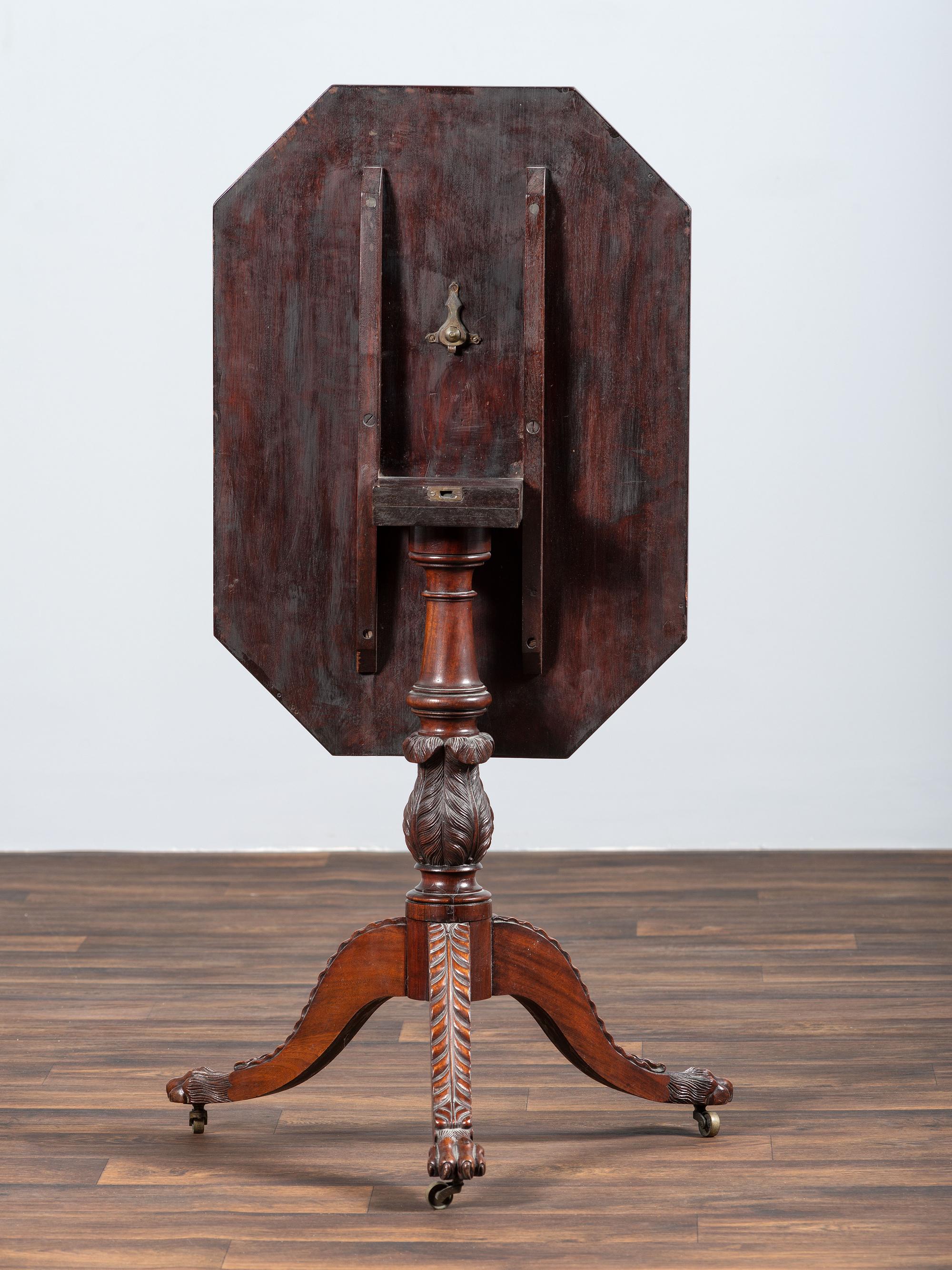 A Late Federal Carved and Figured Mahogany Octagonal Tilt-Top Candlestand