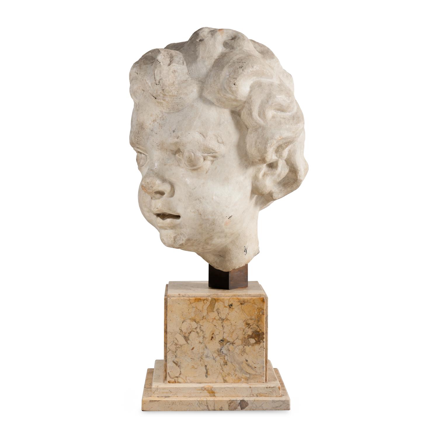 A Large Italian Marble Head of a Putto