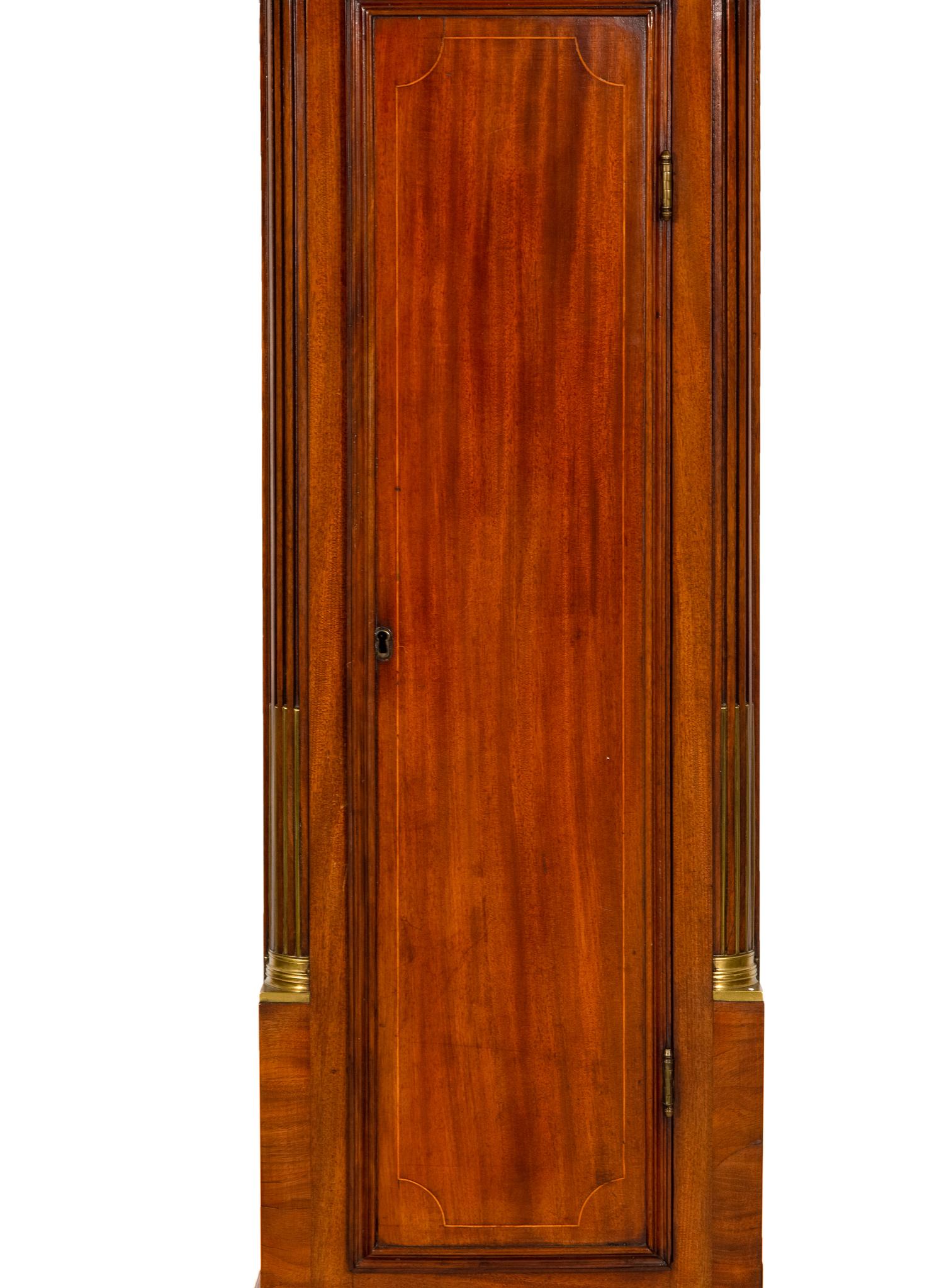 An American Mahogany Brass-Mounted, Inlaid and Carved Mahogany Tall Case Clock