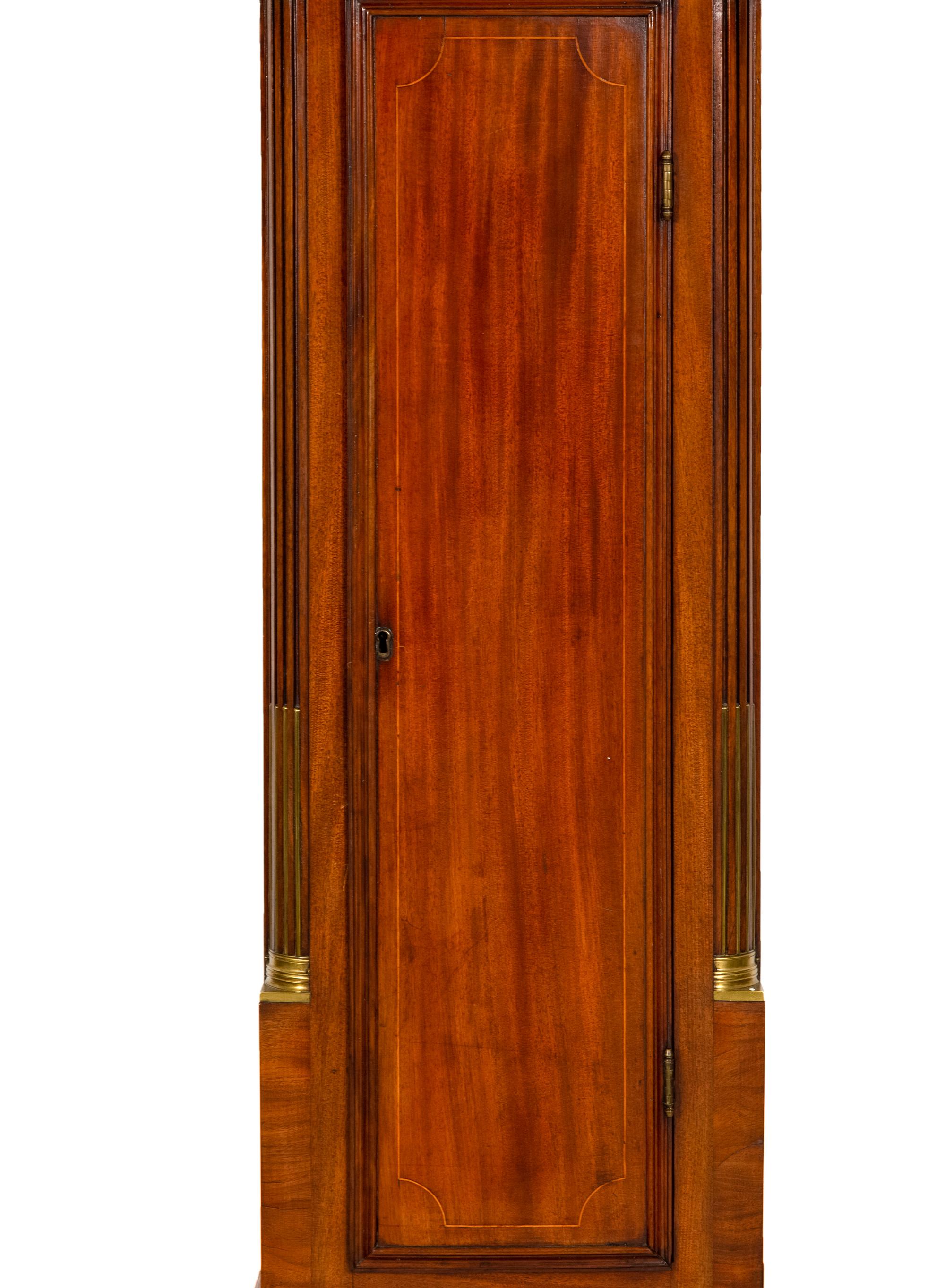 An American Mahogany Brass-Mounted, Inlaid and Carved Mahogany Tall Case Clock