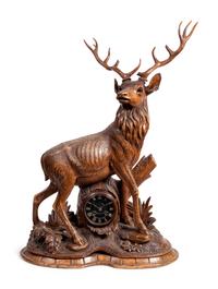 A Black Forest Carved Oak Stag-Form Mantel Clock