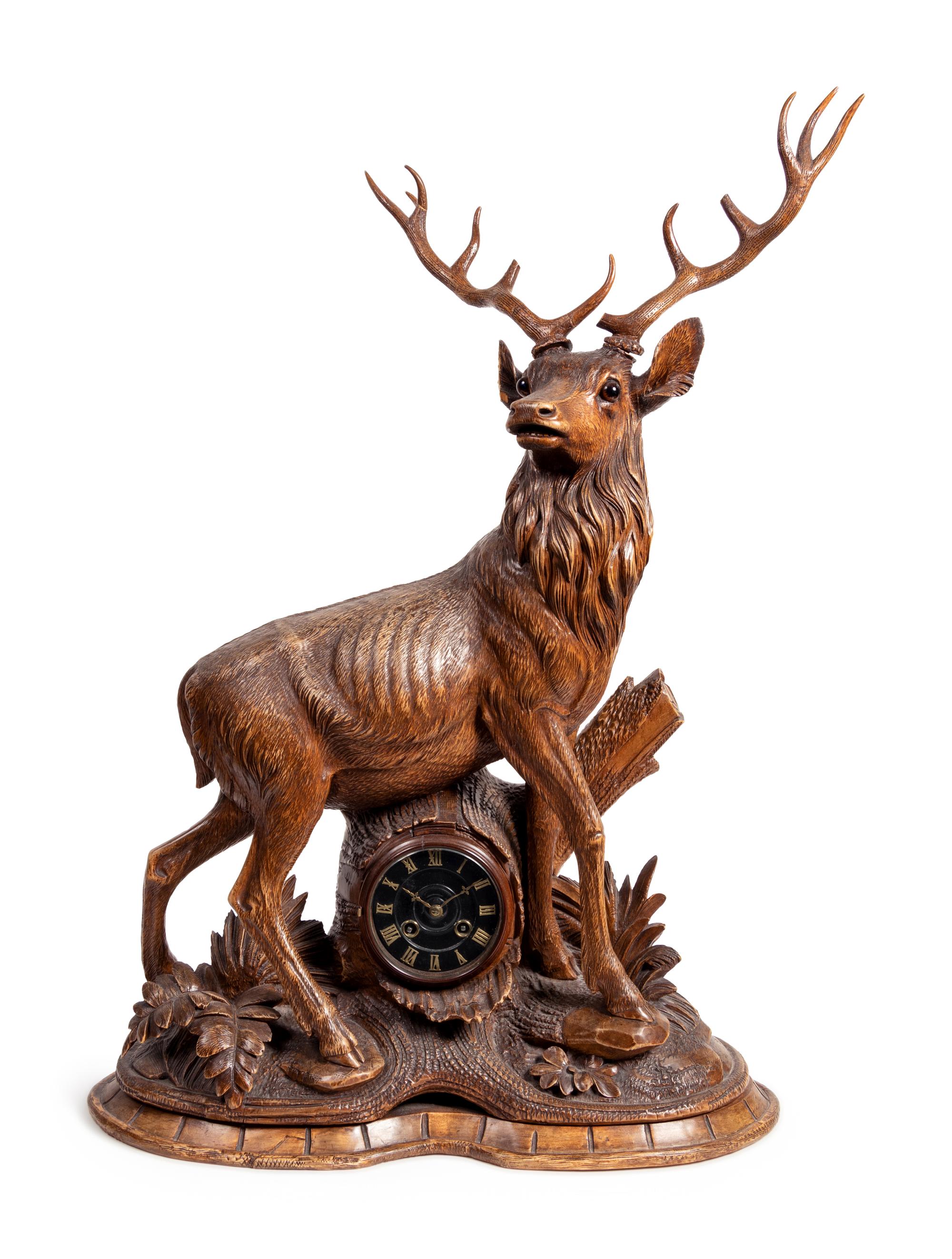 A Black Forest Carved Oak Stag-Form Mantel Clock