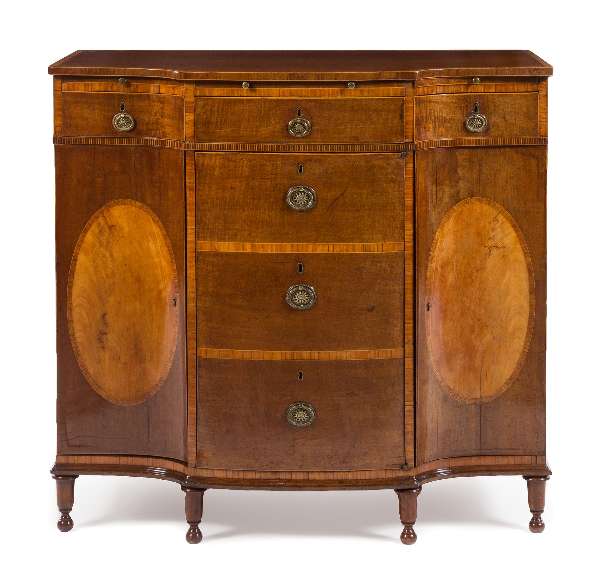A George III Mahogany and Satinwood Inlaid Breakfront Commode Height 38 x width 41 x depth 22 1/2 inches. — CIRCA 1770