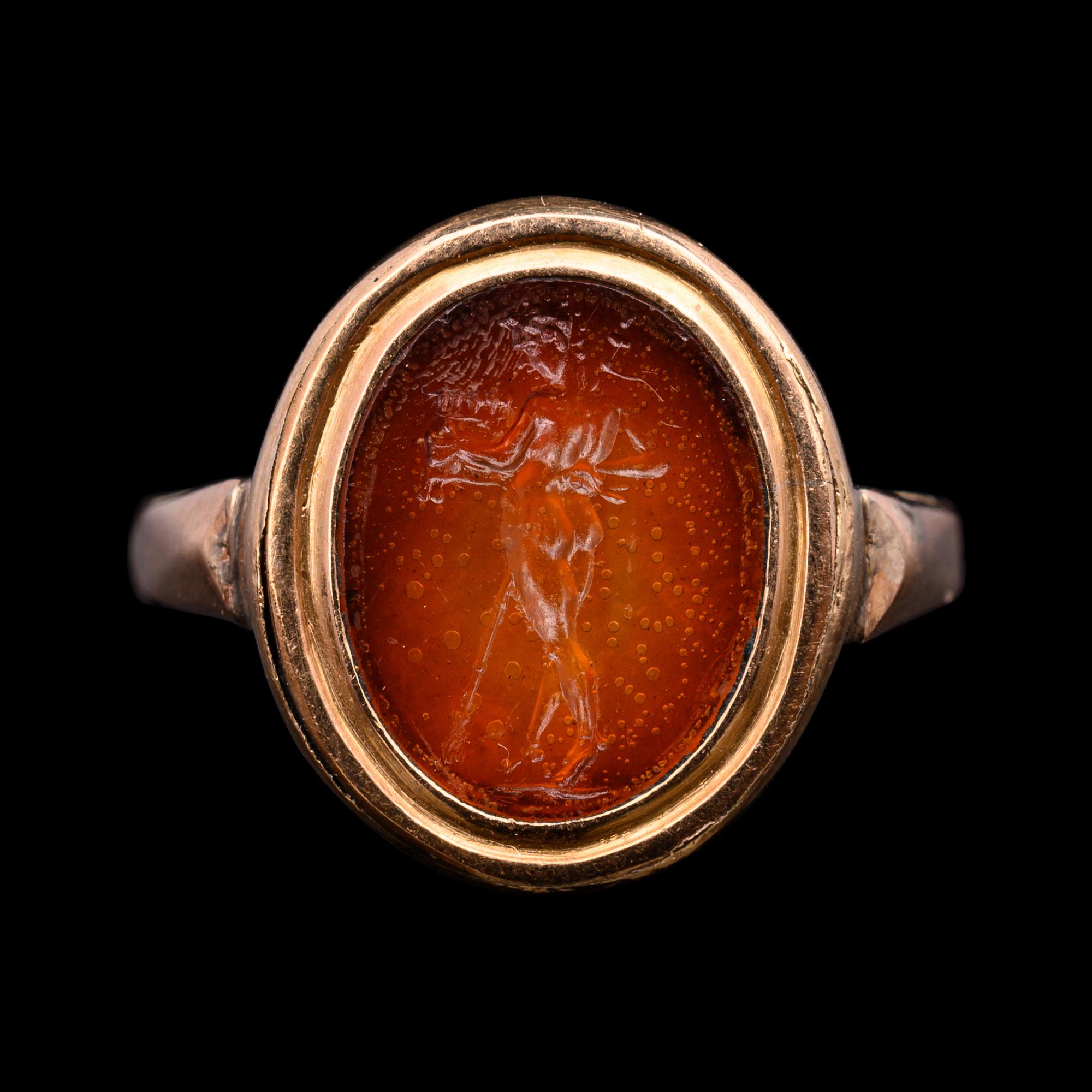 A Roman Glass Intaglio Ring with Pan