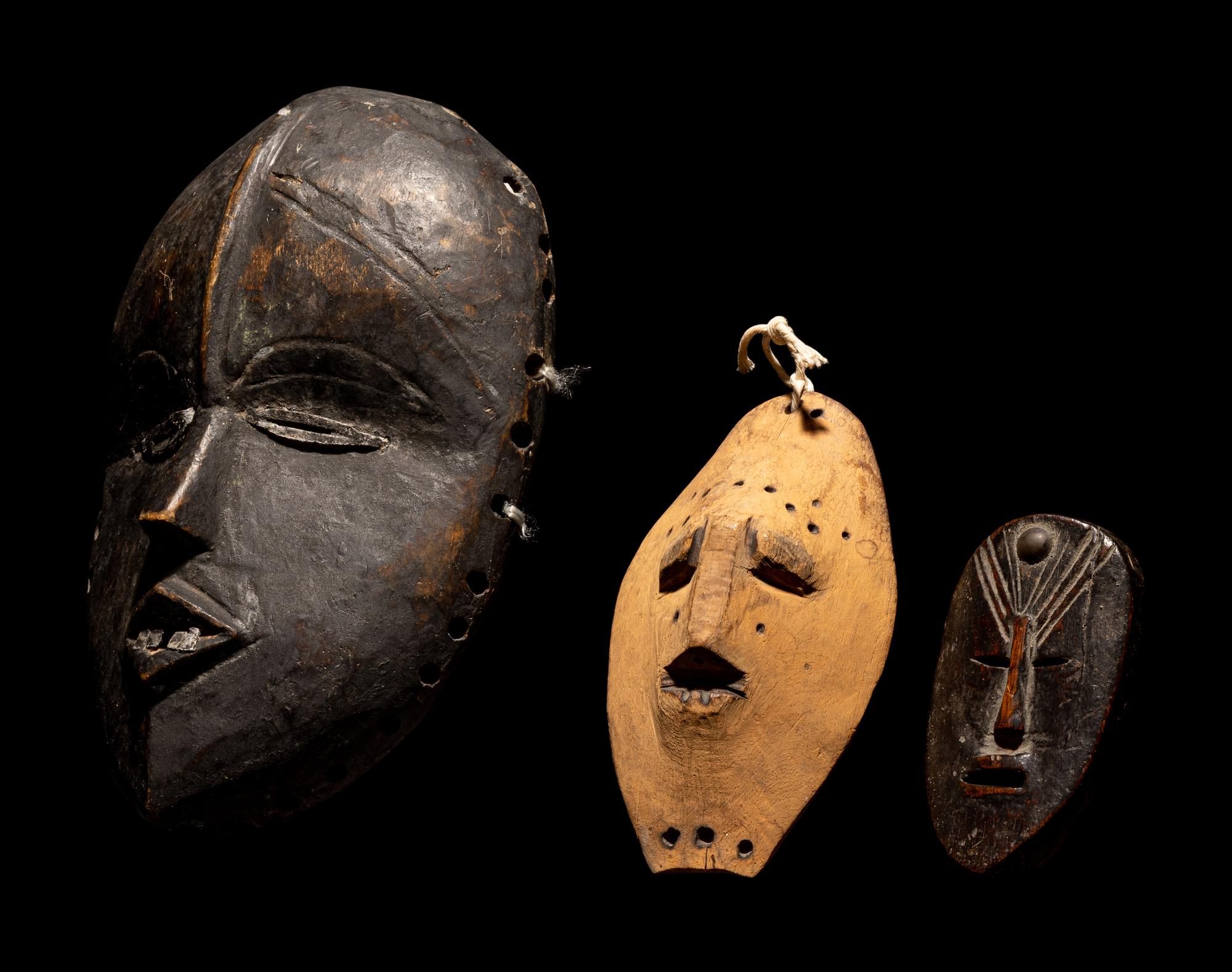 Three Dan Passport Masks, An Ashanti Wood Idol, and Two Wood Figures