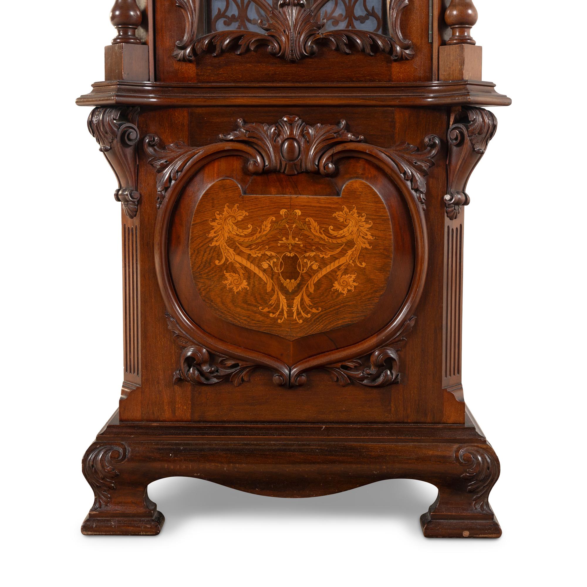 An English Carved Walnut Tall Case Clock