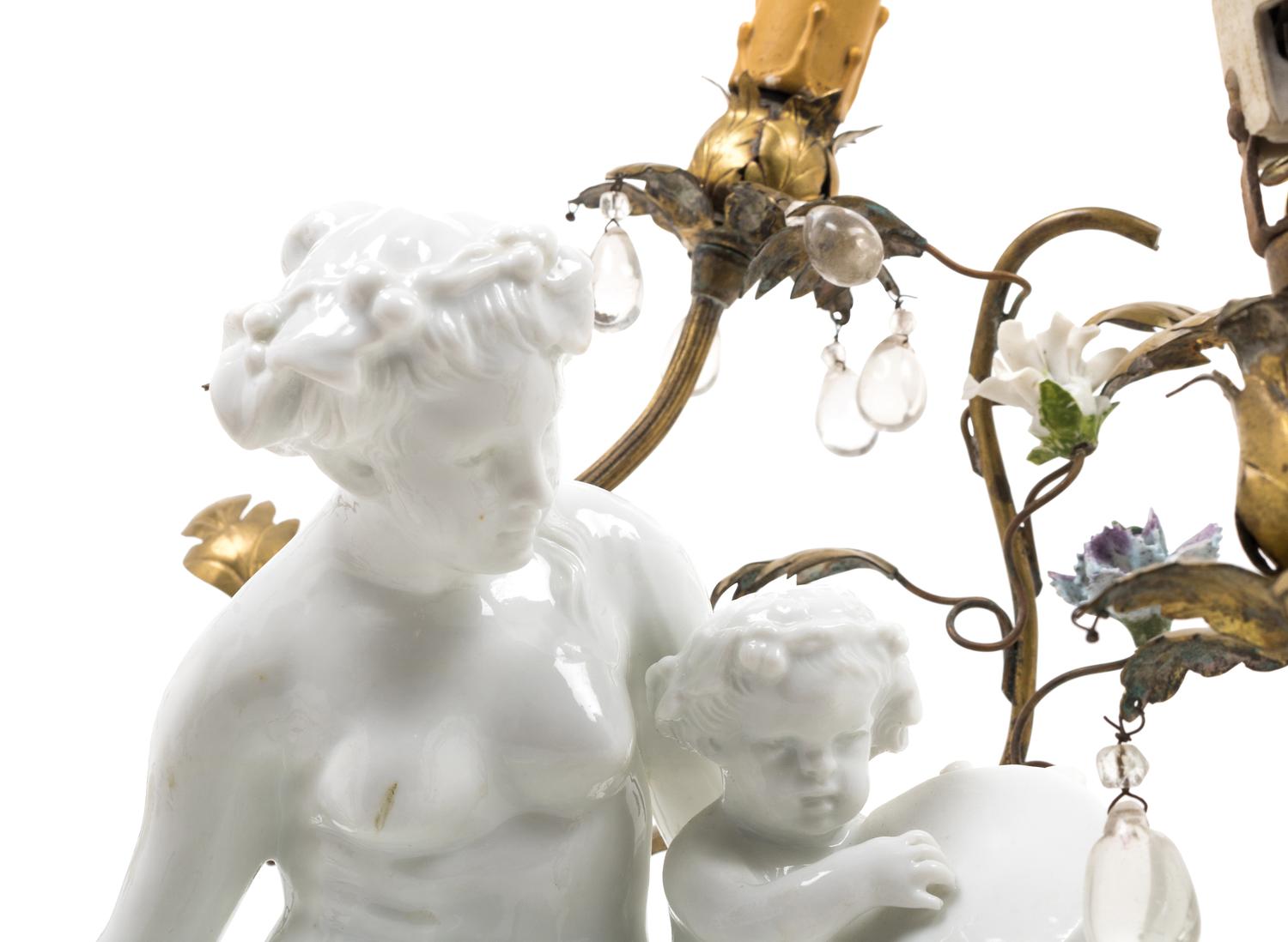 A Gilt Metal Mounted White Glazed Porcelain Figural Group after Clodion Mounted as a Lamp