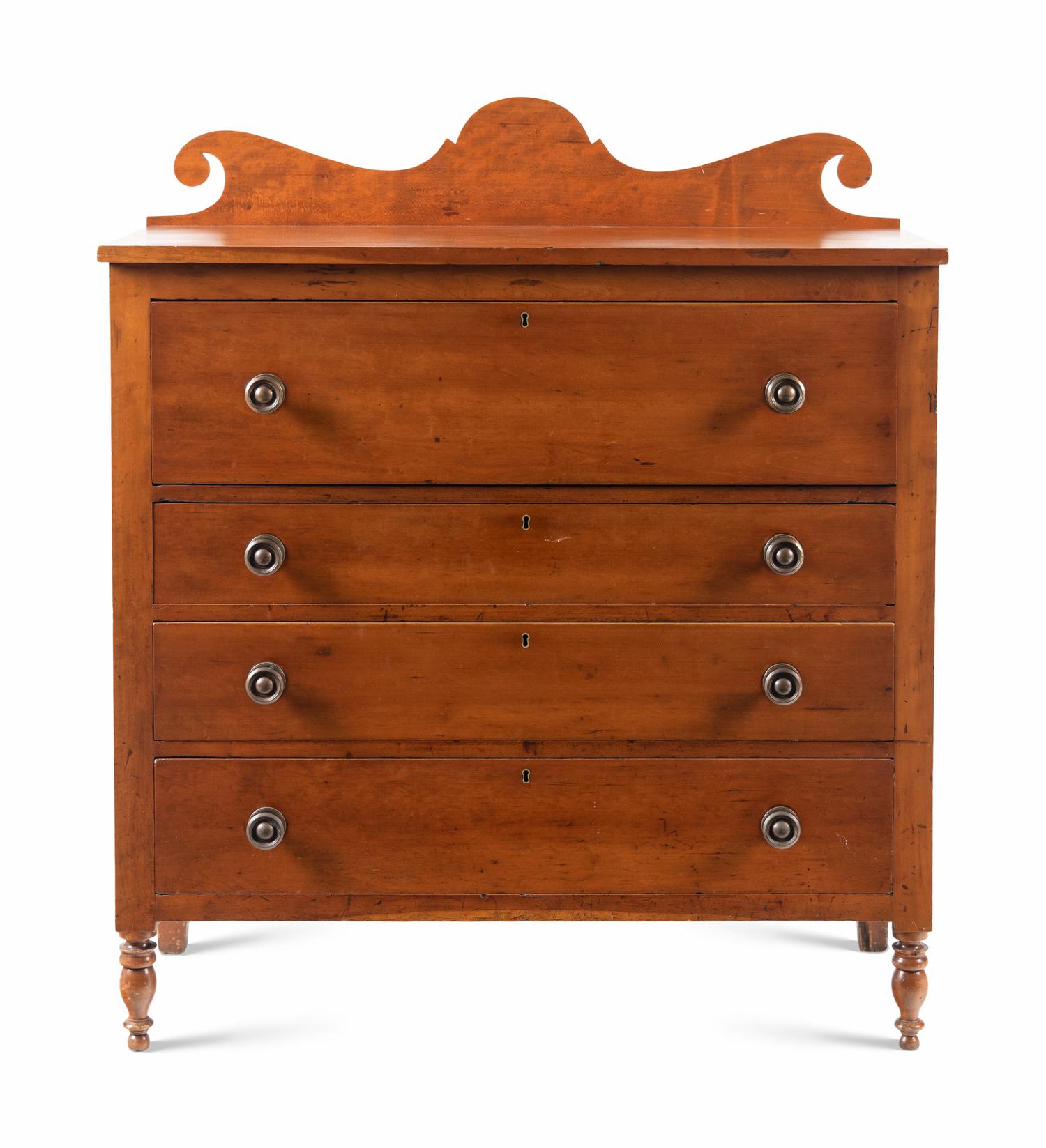 A Late Classical Carved Cherrywood Chest of Drawers