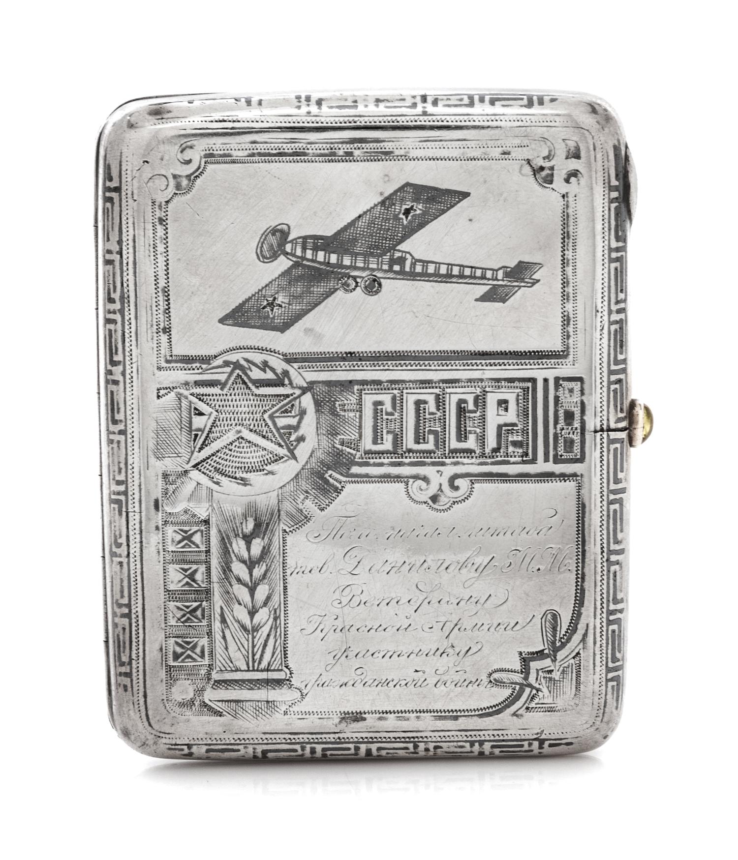 A Russian Niello Silver Cigarette Case, Maker's Mark Obscured, Moscow, Early 20th Century, the case decorated with airplanes and symbol