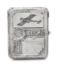 A Russian Niello Silver Cigarette Case, Maker's Mark Obscured, Moscow, Early 20th Century, the case decorated with airplanes and symbol