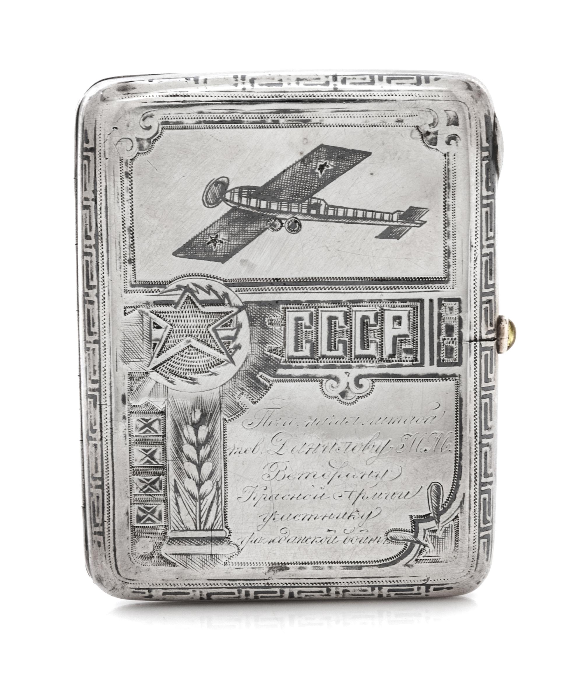 A Russian Niello Silver Cigarette Case, Maker's Mark Obscured, Moscow, Early 20th Century, the case decorated with airplanes and symbol