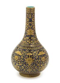 A Gilt Decorated Blue Glazed Porcelain Bottle Vase Height 12 1/2 inches.