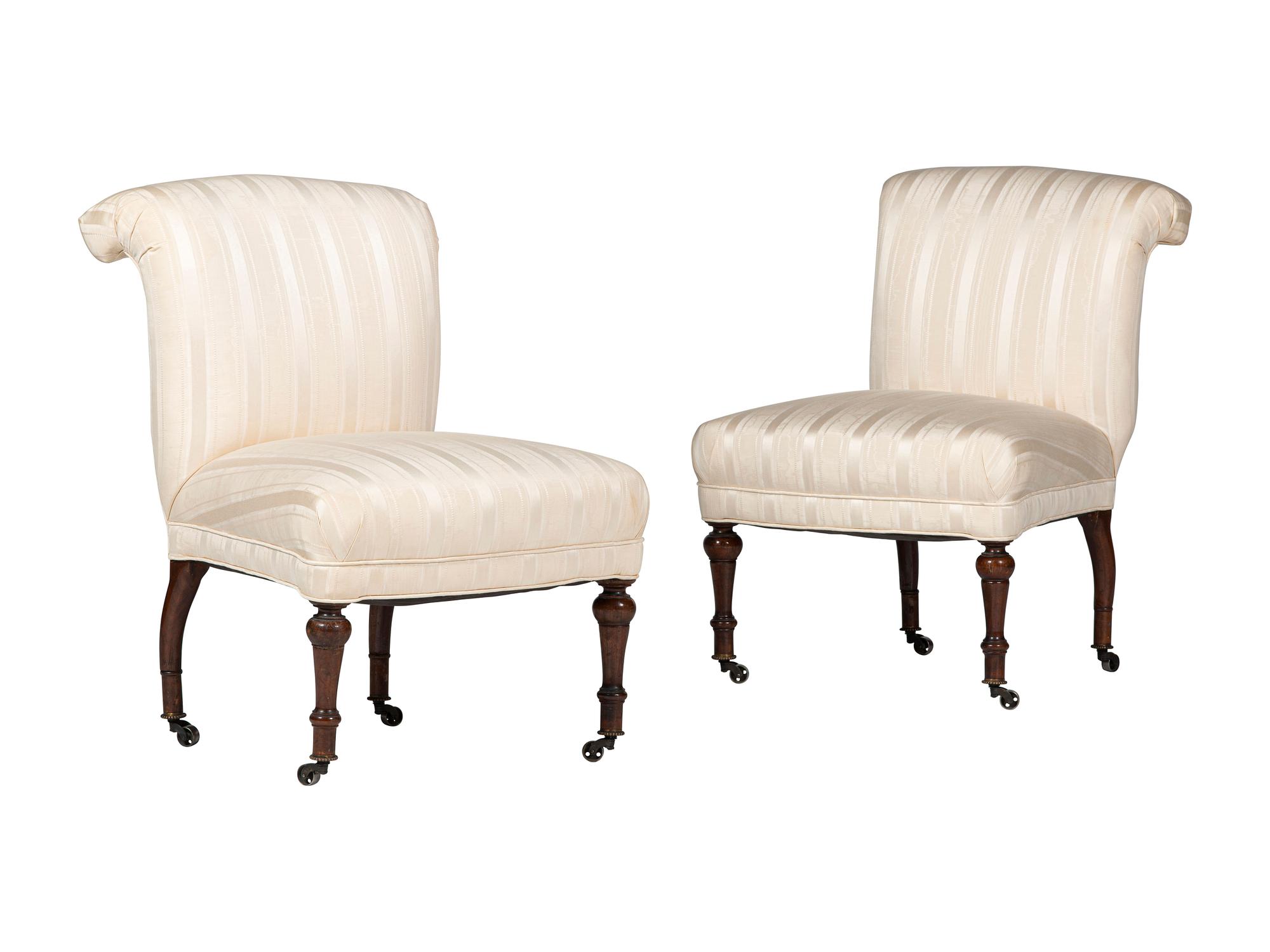 A Pair of Victorian Mahogany Roll Back Slipper Chairs