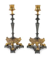A Pair of French Empire Style Brass and Steel Candlesticks