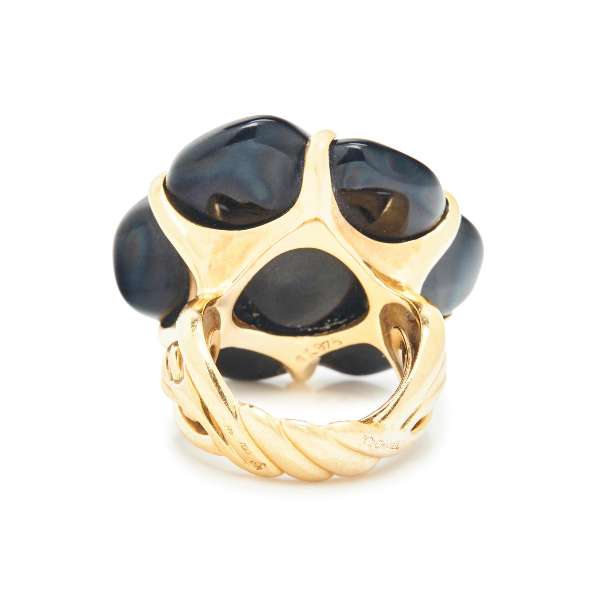 CHANEL, YELLOW GOLD AND CARVED ONYX CAMELLIA RING