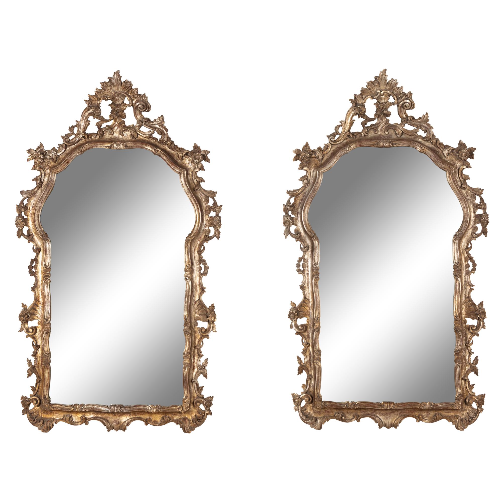 A Pair of Italian Baroque Style Silvered Wood Mirrors