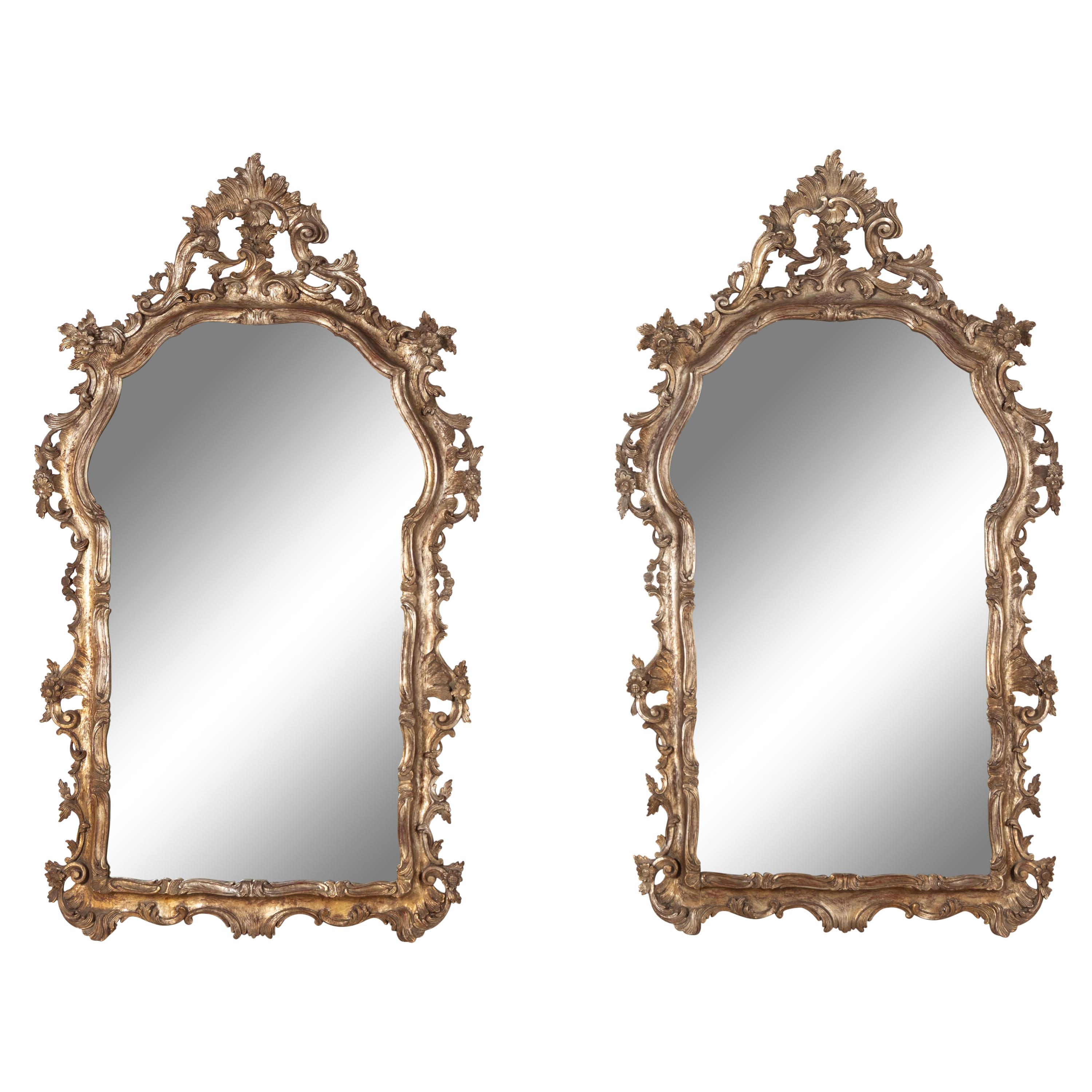 A Pair of Italian Baroque Style Silvered Wood Mirrors