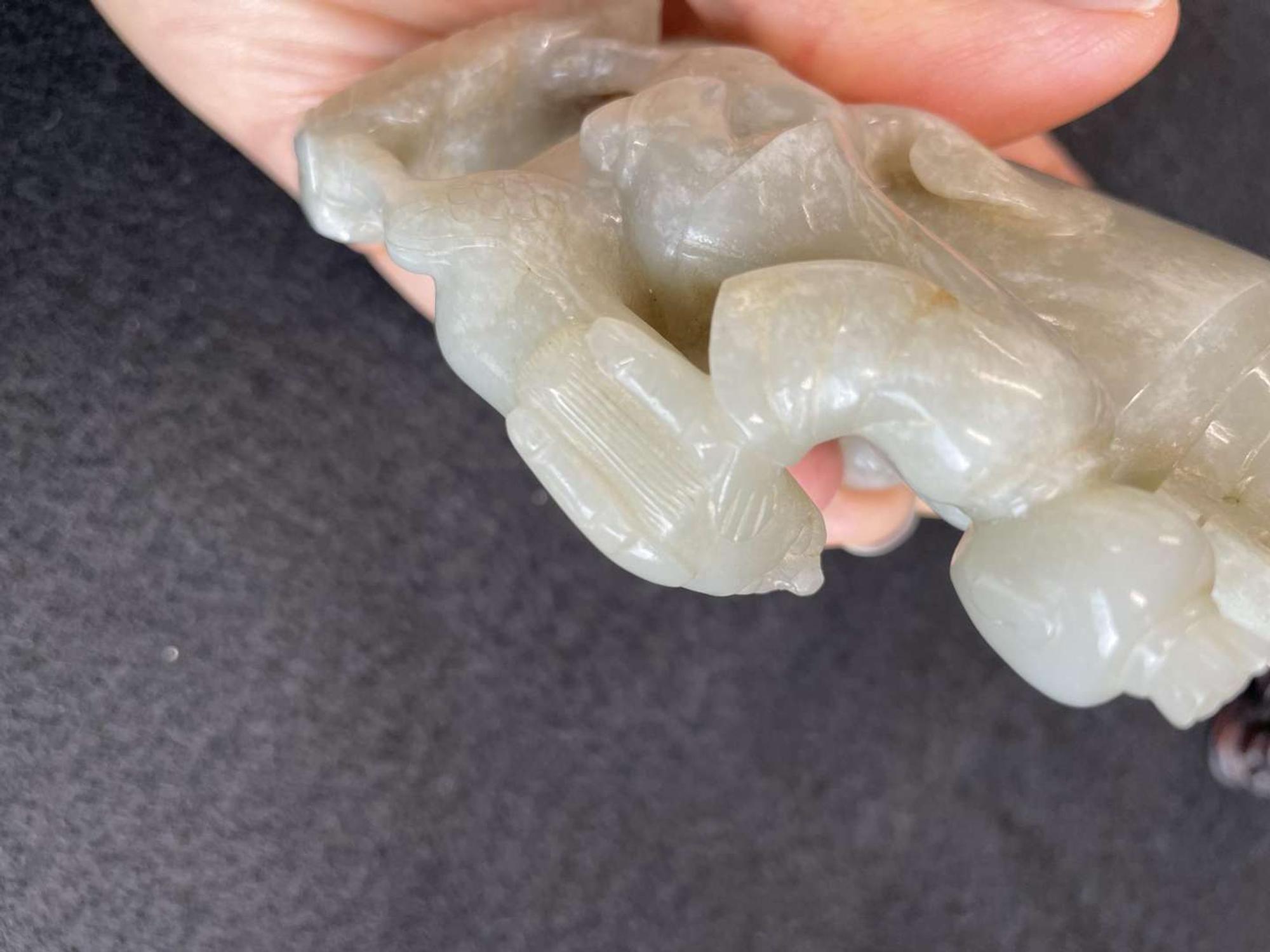 A Chinese jade "Boys, Kylin and Phoenix" vase on carved wood stand 玉雕童子凤鸟花樽及底座