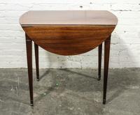 An English Mahogany Drop Leaf Table Height 28 x width 18 1/2 x depth 31 inches (closed). — 19TH CENTURY