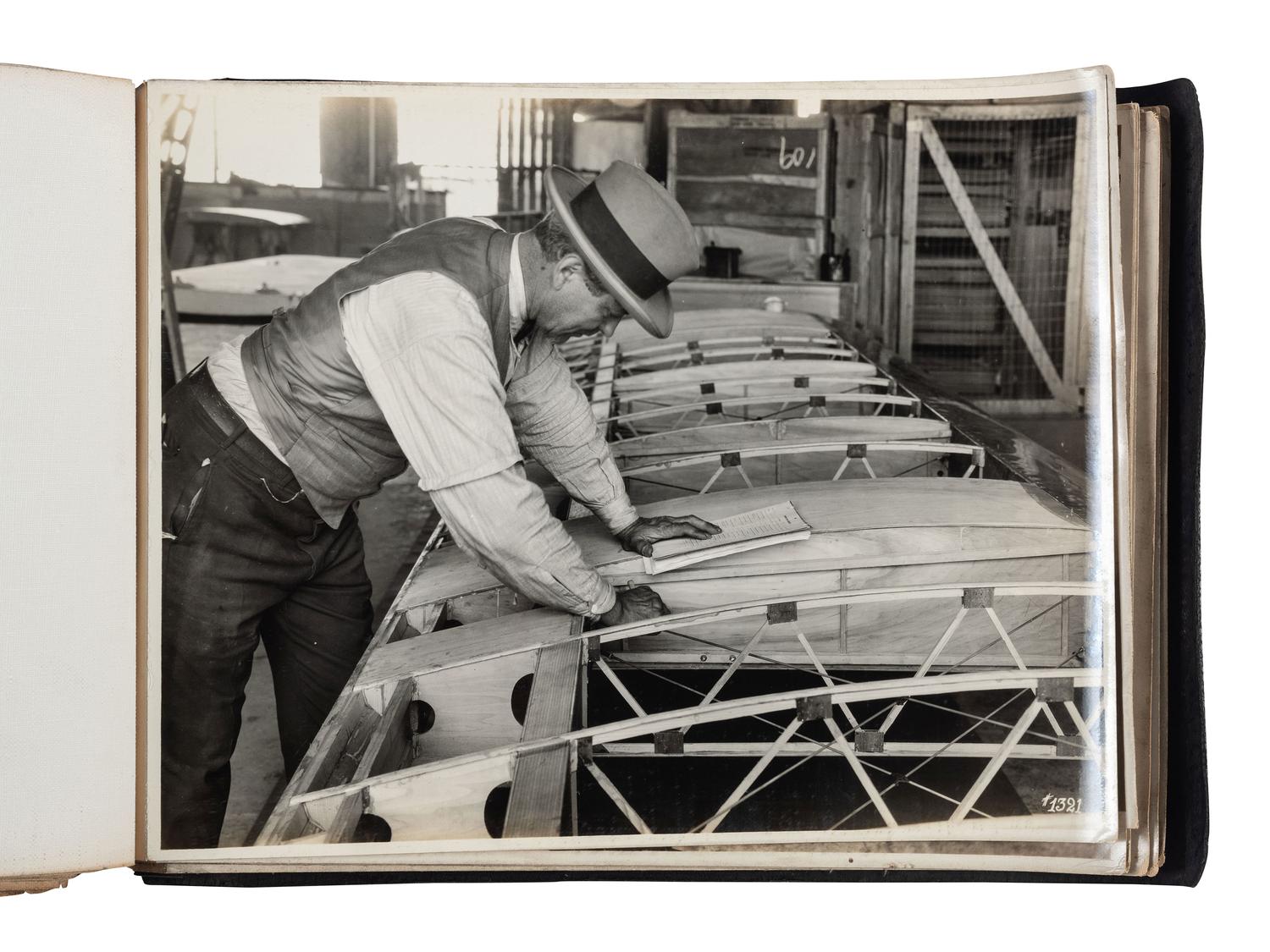 [AVIATION]. SMITH, Edgar B. (1896-1966), photographer. Rare photographic salesman aviation album documenting various airplanes and their construction at the plant of the Travel Air Manufacturing Company of Wichita, Kansas. Ca 1929.