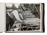 [AVIATION]. SMITH, Edgar B. (1896-1966), photographer. Rare photographic salesman aviation album documenting various airplanes and their construction at the plant of the Travel Air Manufacturing Company of Wichita, Kansas. Ca 1929.