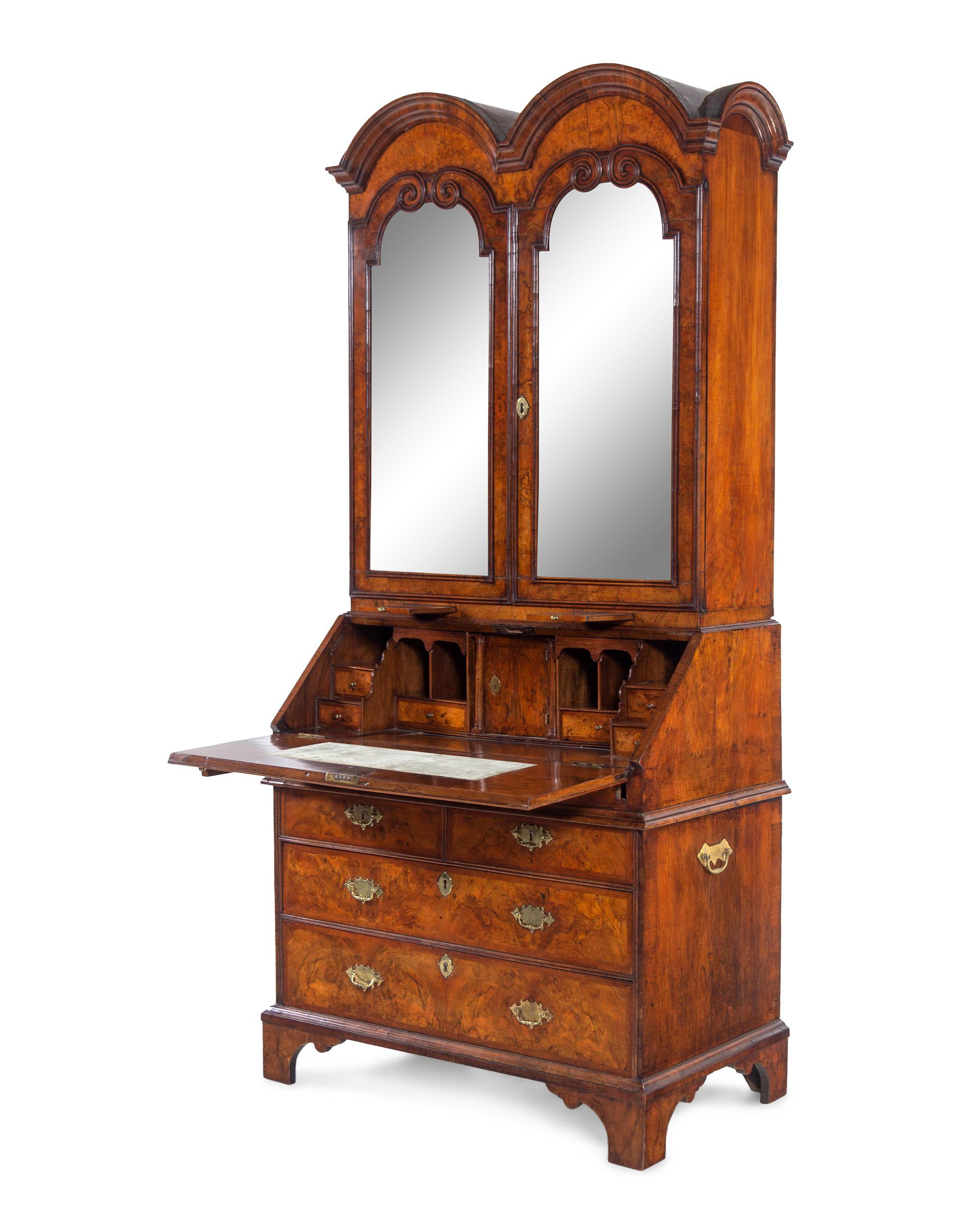 A George I Carved Burl Walnut Double-Dome Bureau Bookcase