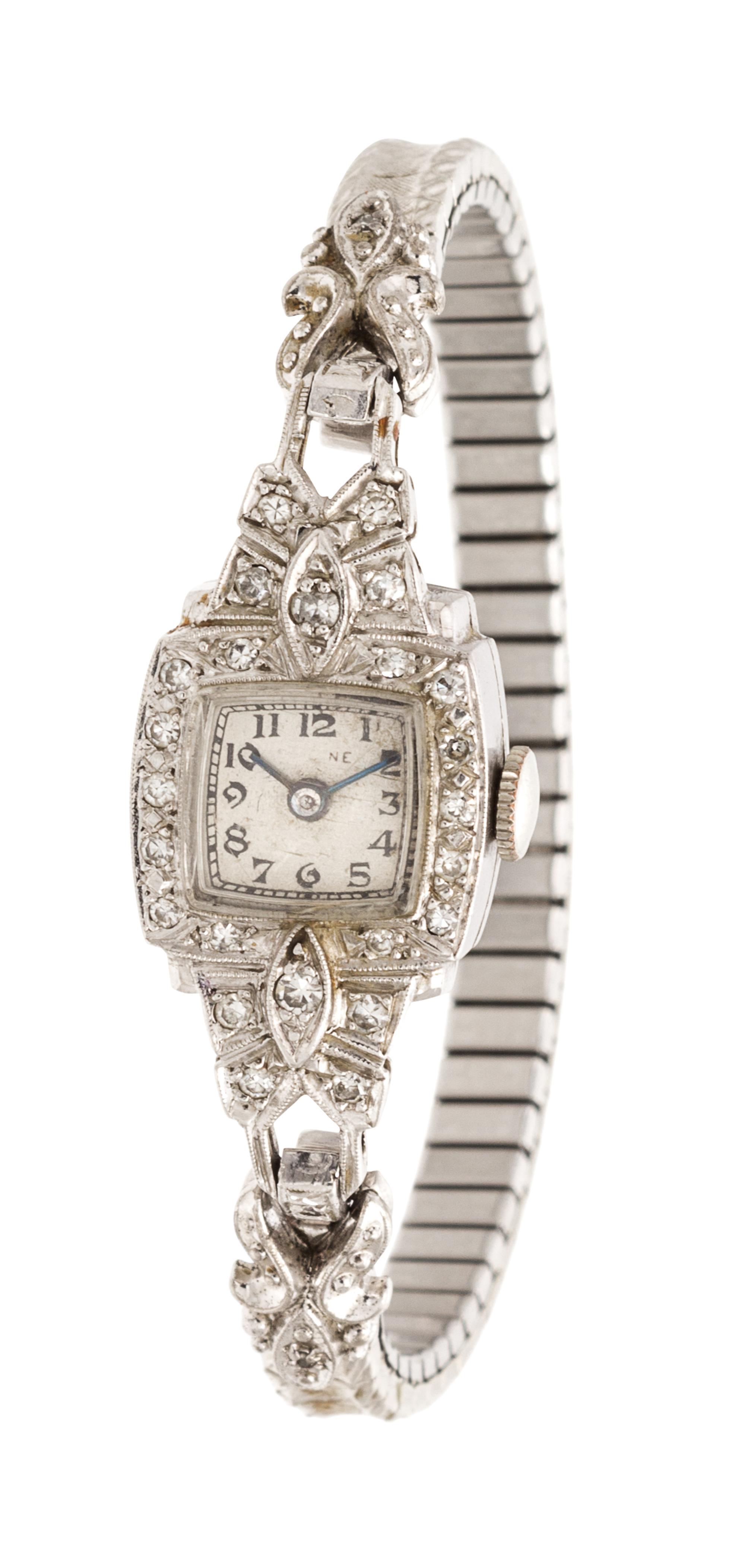 A Collection of Platinum, 14 Karat White Gold and Diamond Wristwatches,