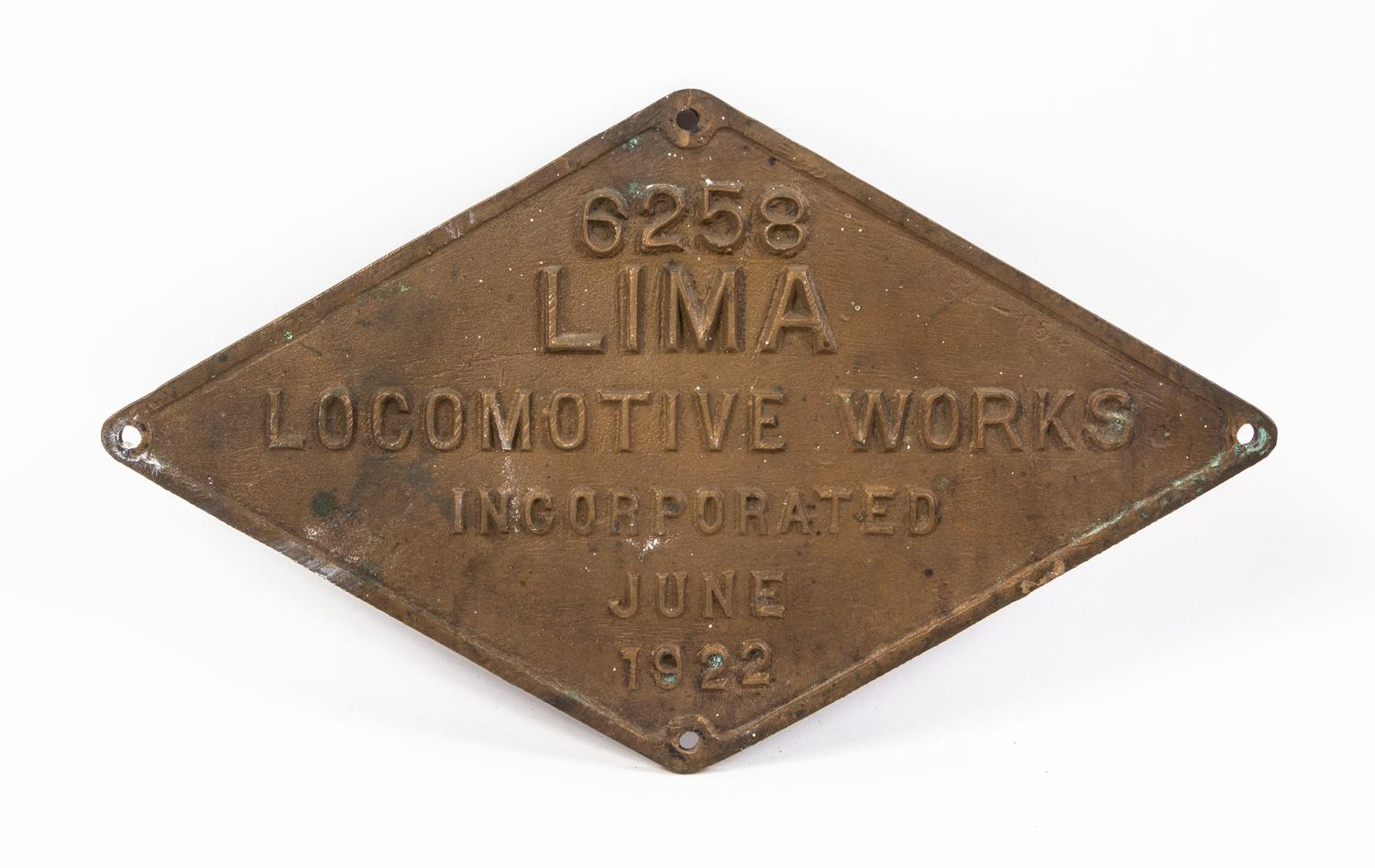 A Painted Metal Lima Locomotive Works Locomotive Badge