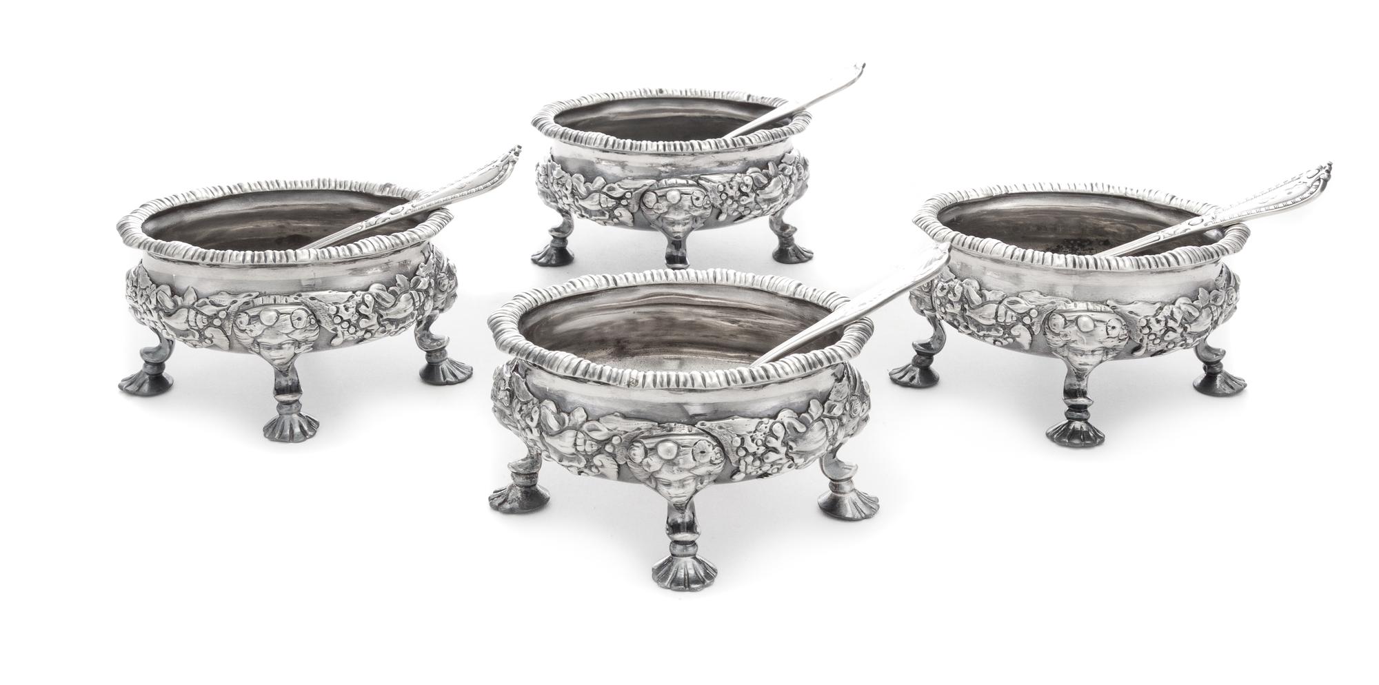 A Set of Four George II Silver Salt Cellars, David Hennell, London, 1750, each having an undulating gadroon rim, the bodies worked with