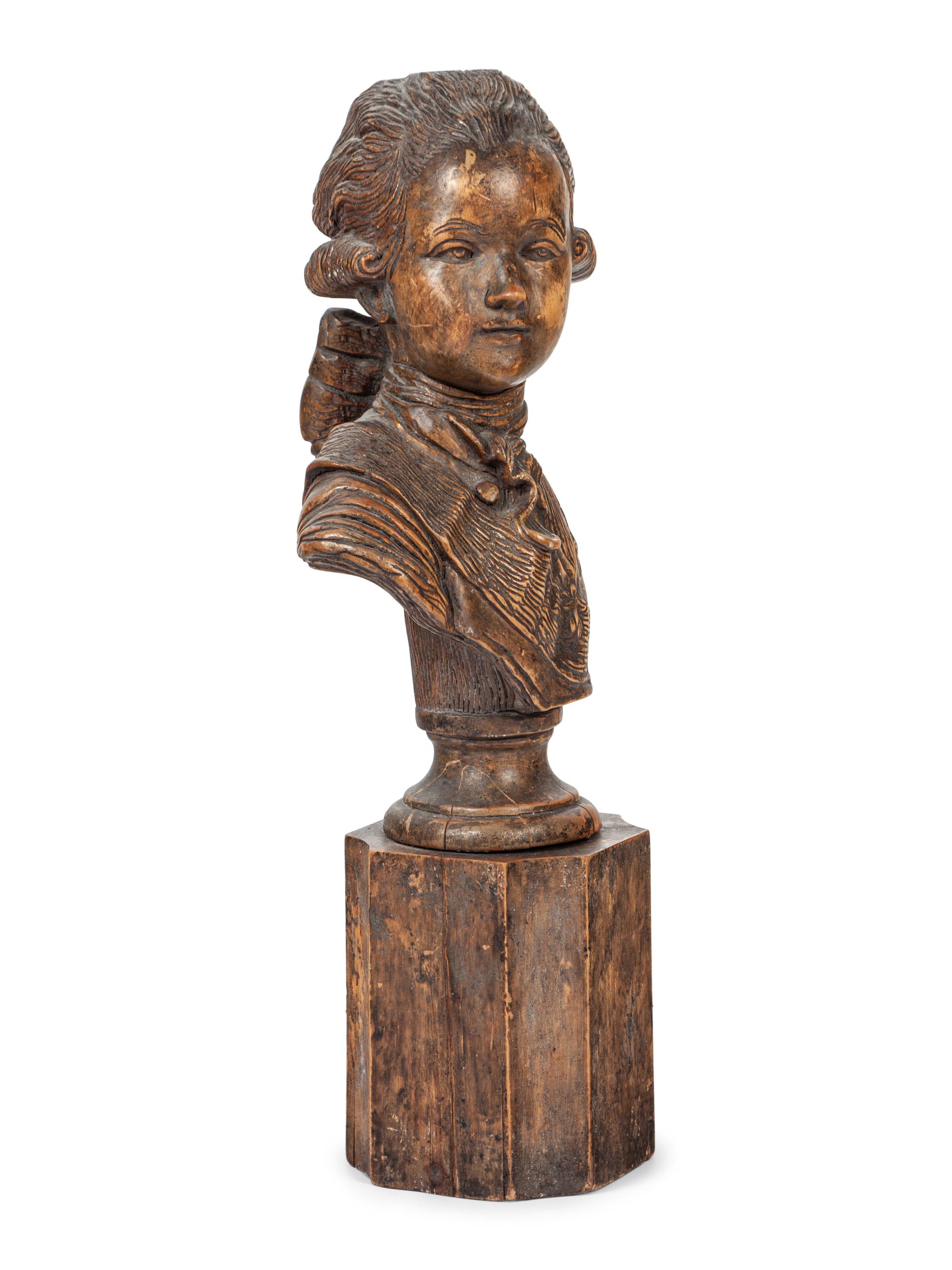 A French Carved Fruitwood Bust of a Young Louis XVI